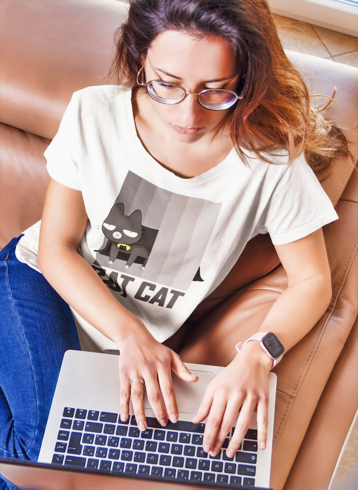 BATCAT tee in white, woman working on a laptop on a couch, funny cat lover gift shirt
