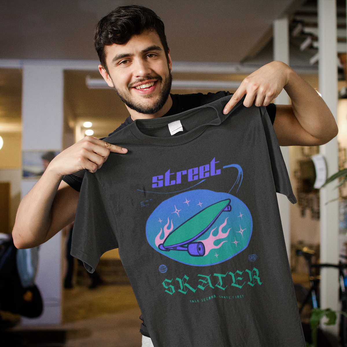"Street Skater" retro skateboard t-shirt in charcoal, man holding it up, funny gift for skateboarders
