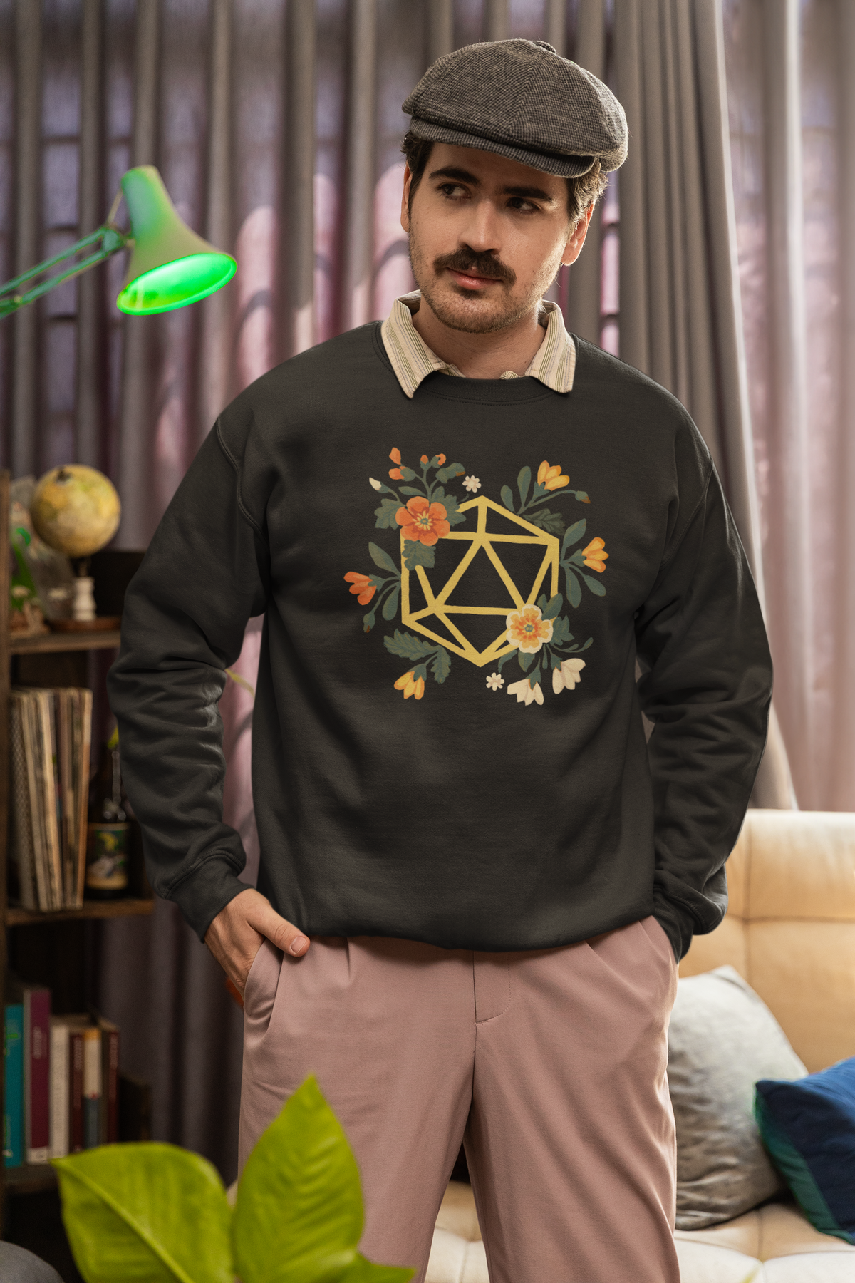 Flower Polyhedron Sweatshirt in black, man wearing it indoors with newsboy cap, cozy floral dnd pullover