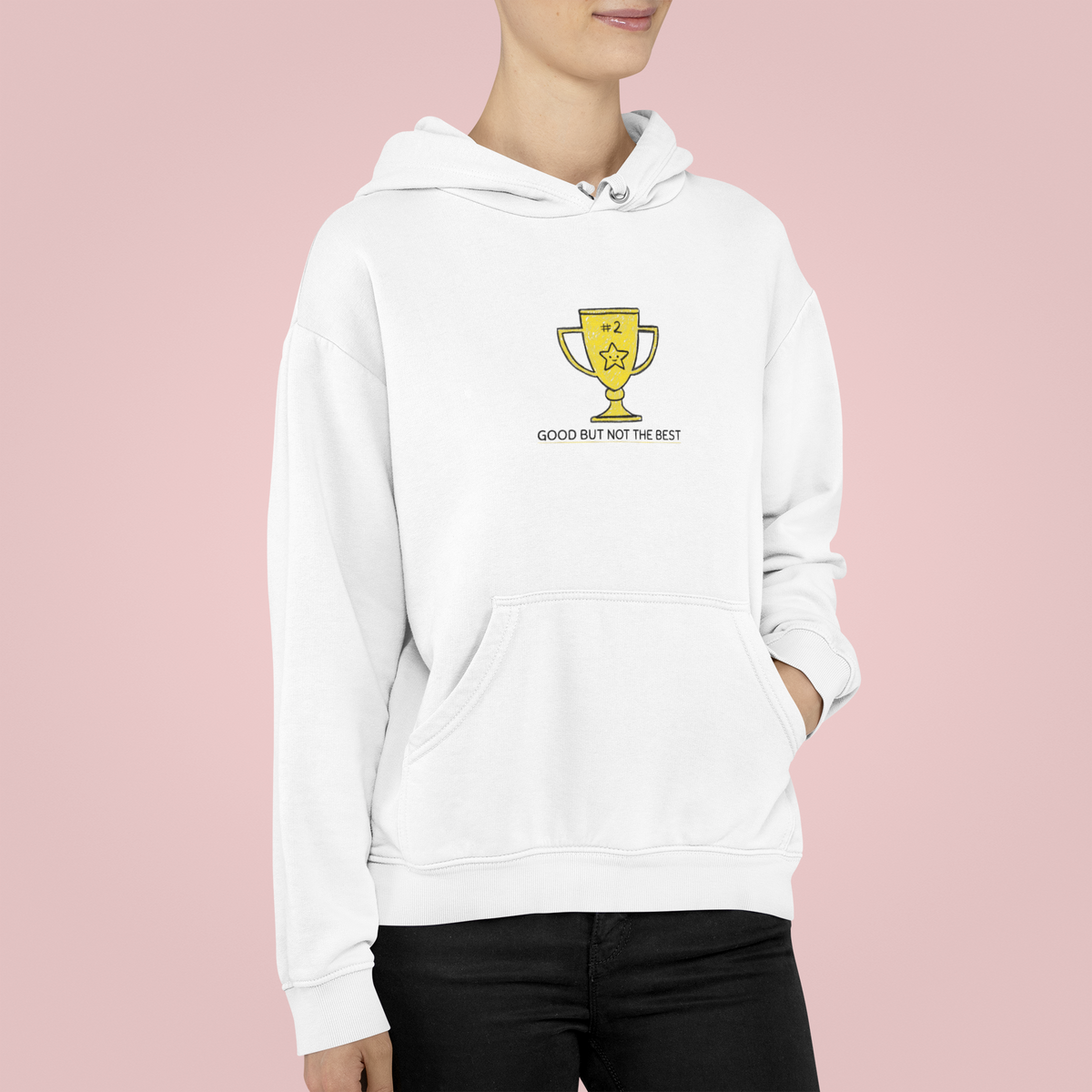 'Good But Not The Best' trophy graphic hoodie in white, woman wearing it against pink, funny gift