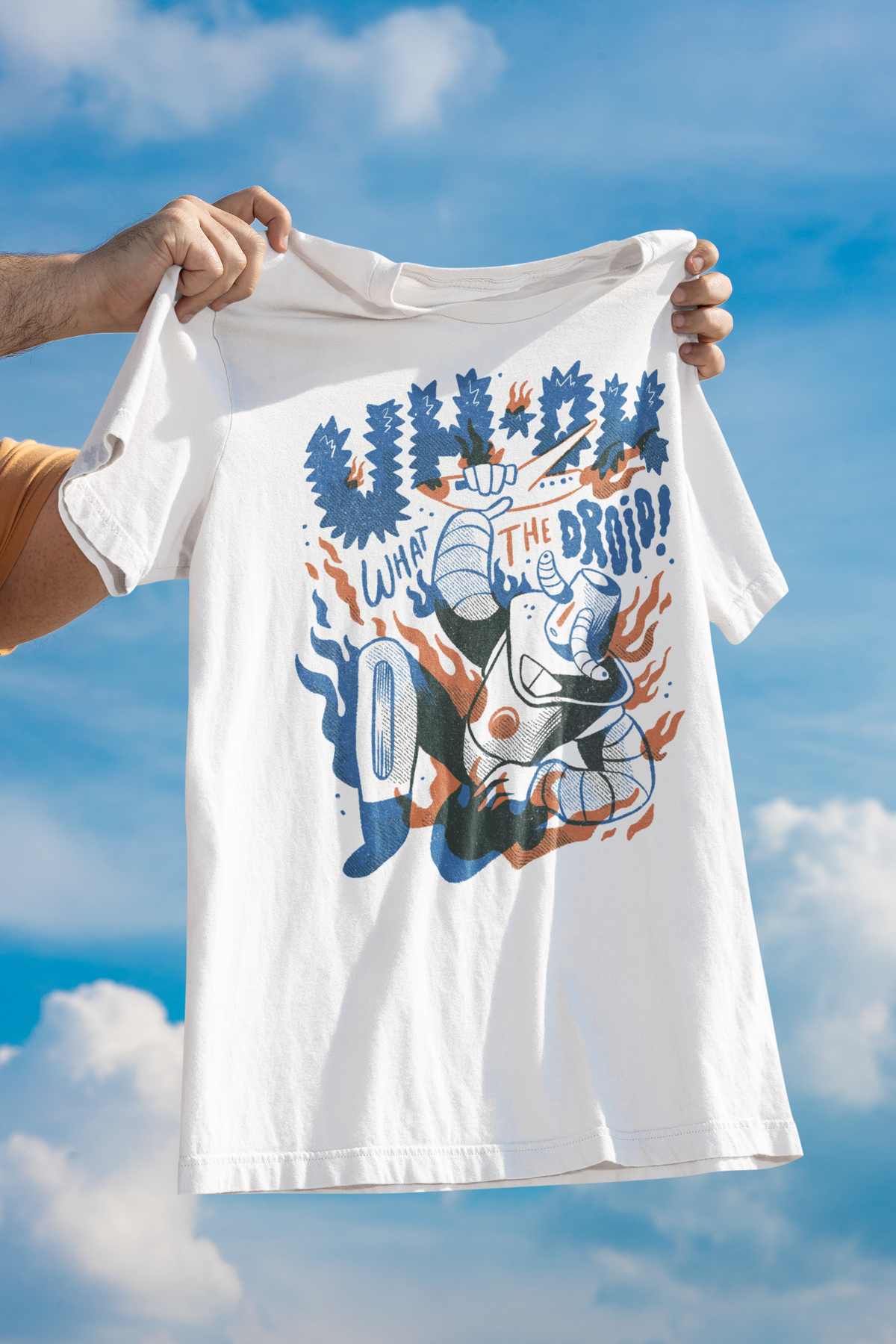 'Uh-Oh' droid attack t-shirt in white, held up flat lay against a cloudy sky backdrop