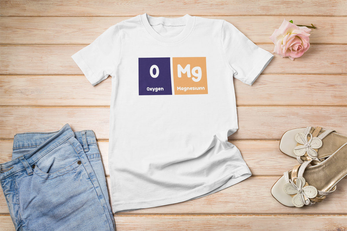 'O-Mg' periodic table t-shirt in white, flat lay styled with jeans and sandals, funny chemistry gift