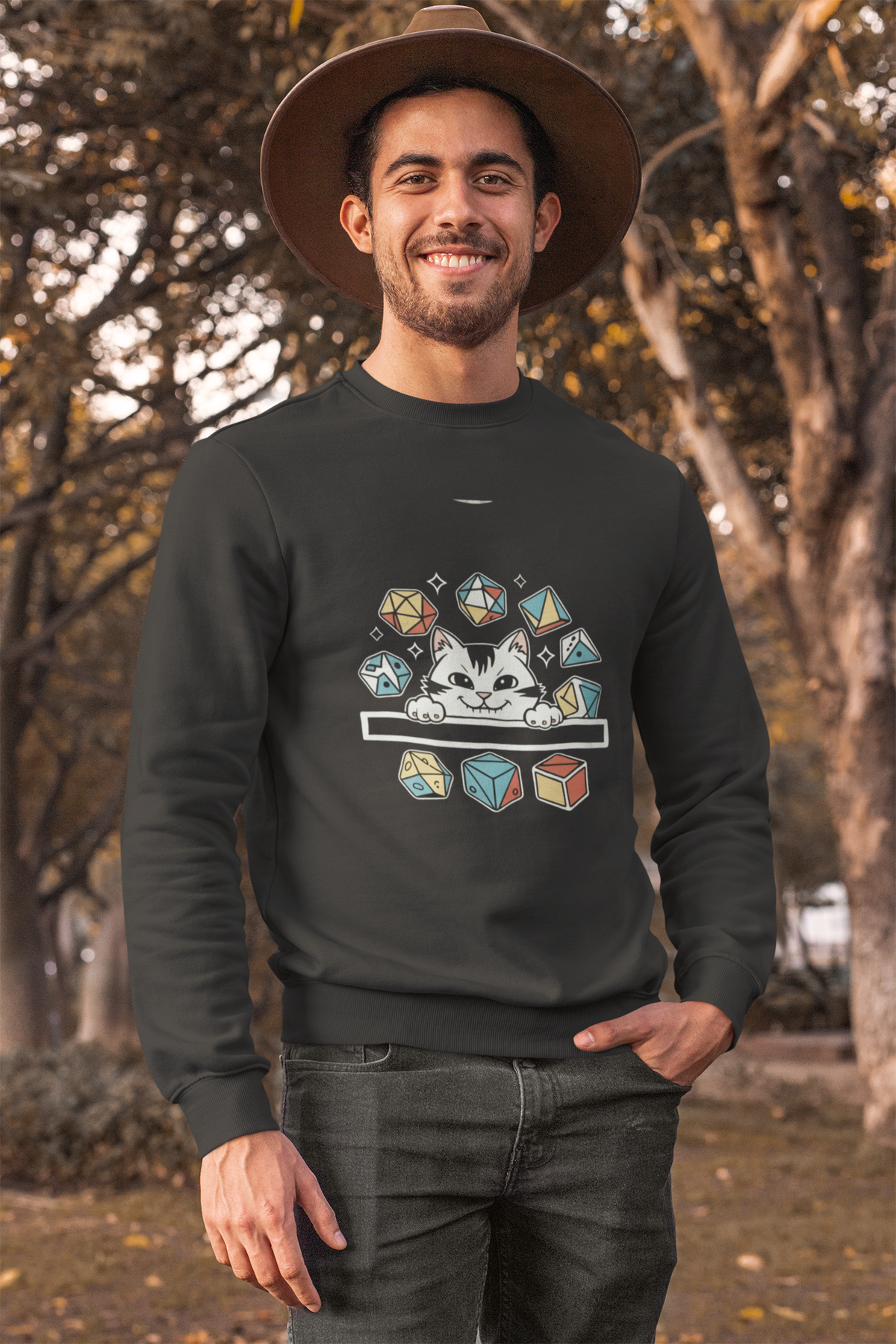 'Cat Dice' sweatshirt in black, bearded man wearing it outdoors among trees, funny gamer pun sweatshirt gift