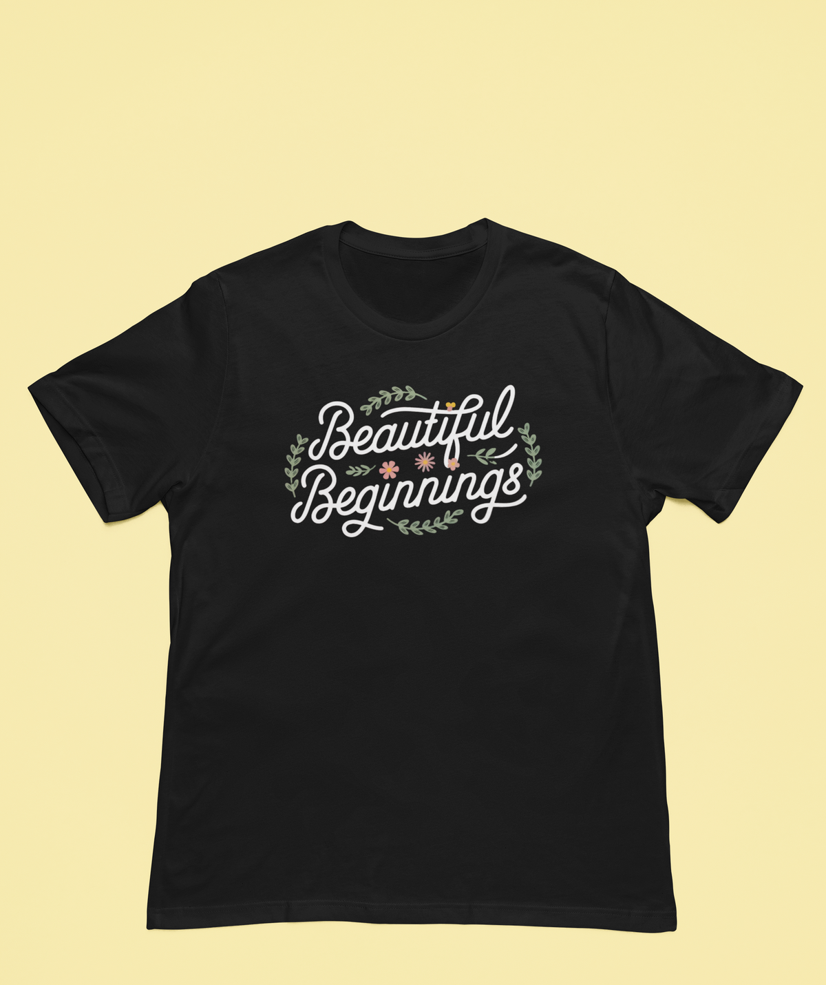 Beautiful Beginnings black t-shirt close-up flat lay on yellow background, funny inspirational gift