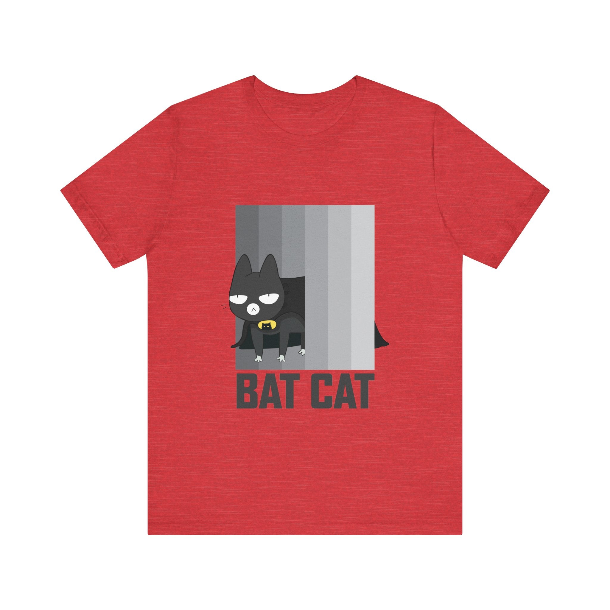 The BATCAT T-Shirt is a unisex tee featuring an eye-catching design of a cartoon cat dressed as a superhero, with the playful "BAT CAT" text below. Made from soft cotton, it is perfect for bringing a whimsical touch to any wardrobe.