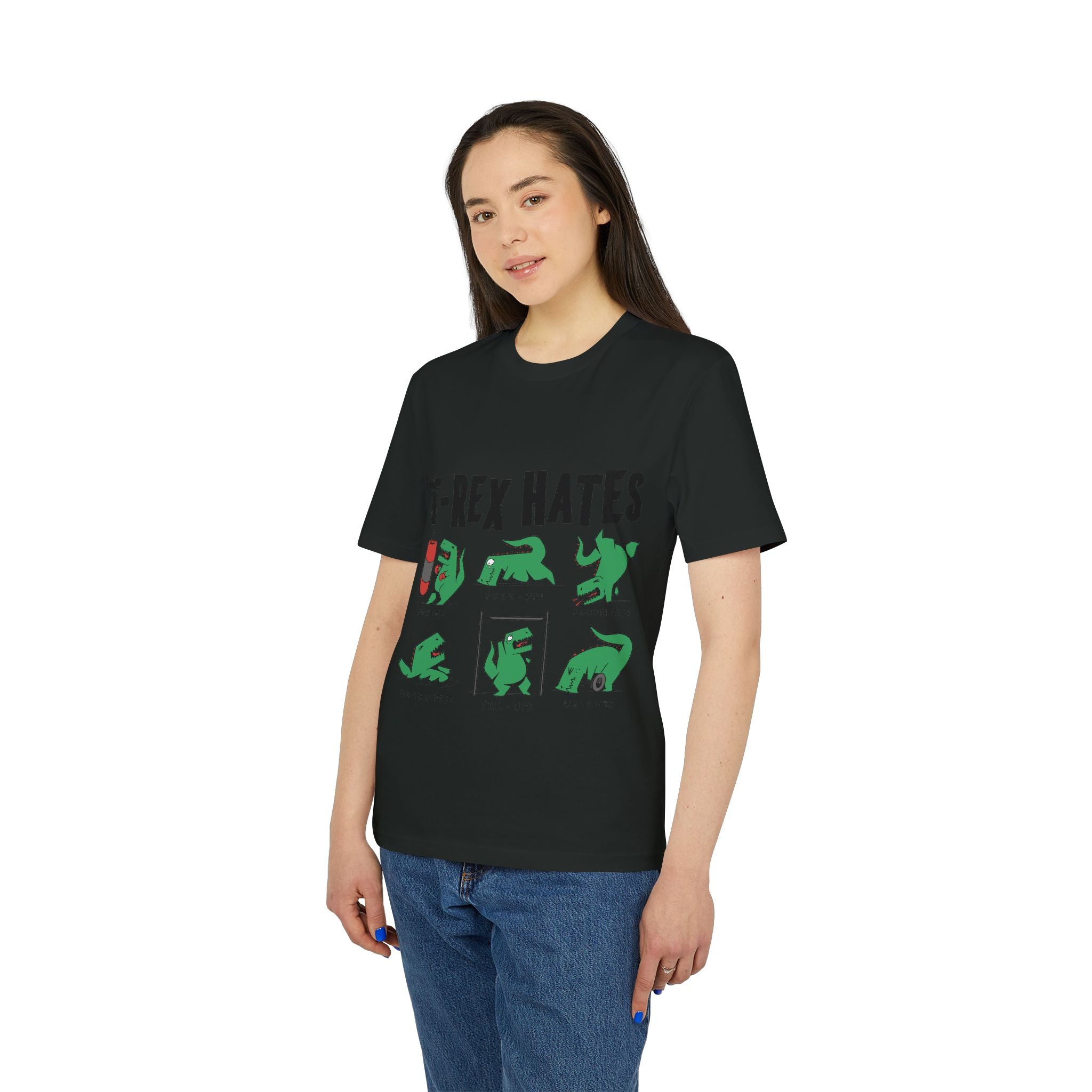 A person wearing the Trex Hates - Organic T-Shirt, a black eco-friendly tee featuring green cartoon dinosaurs and "T-Rex Hates" text, stands against a white background.