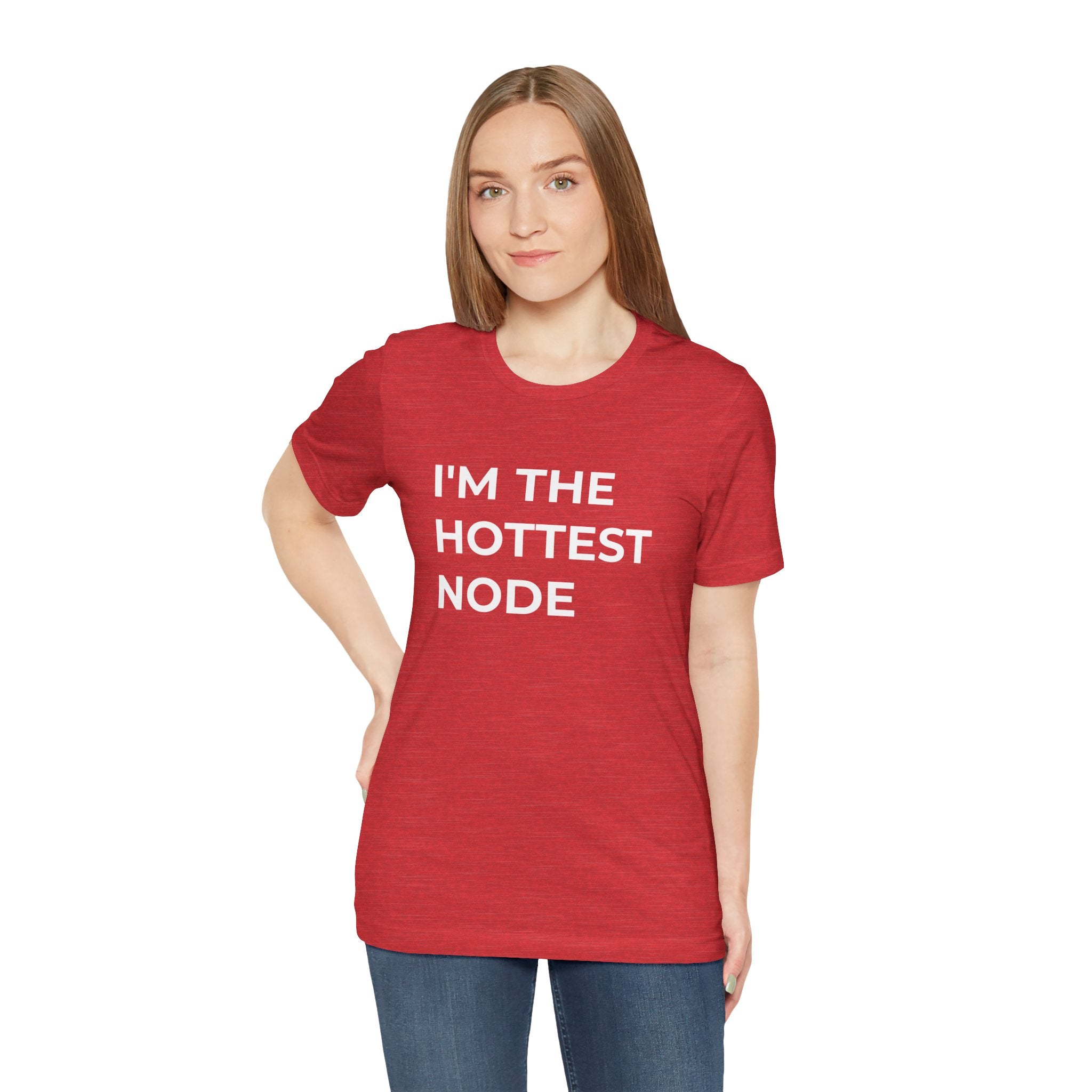 A person wearing the "I'm The Hottest Node - T-Shirt," made of red Airlume cotton, exudes comfort while standing against a plain white background.