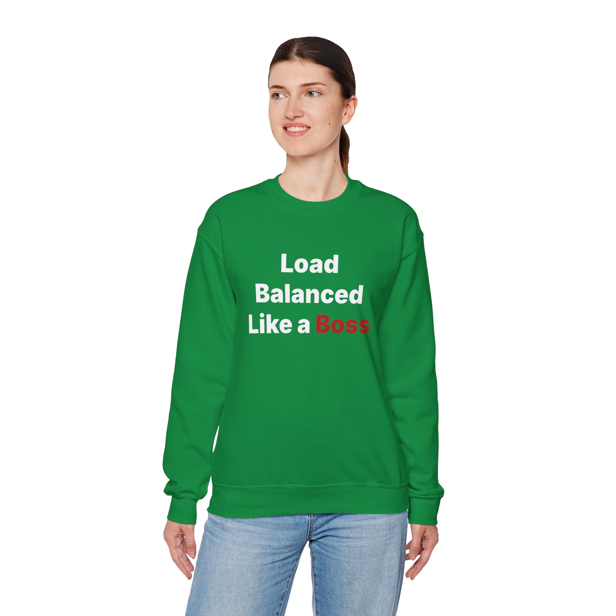 A person is wearing the "Load Balanced Like a Boss" sweatshirt, featuring cozy green fabric and bold white and red lettering, making it perfect for chilly weather.