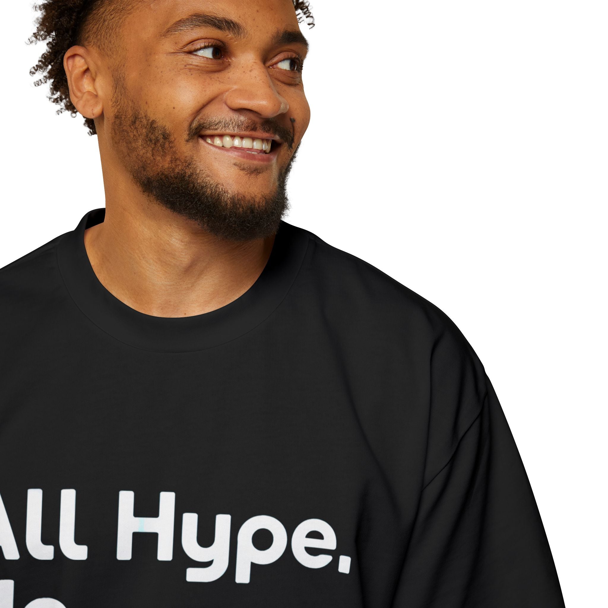 A smiling man with short hair and a beard wears the ALL HYPE NO COMPUTE Heavy Oversized Tee, featuring a relaxed fit and cozy 100% carded cotton for ultimate comfort.