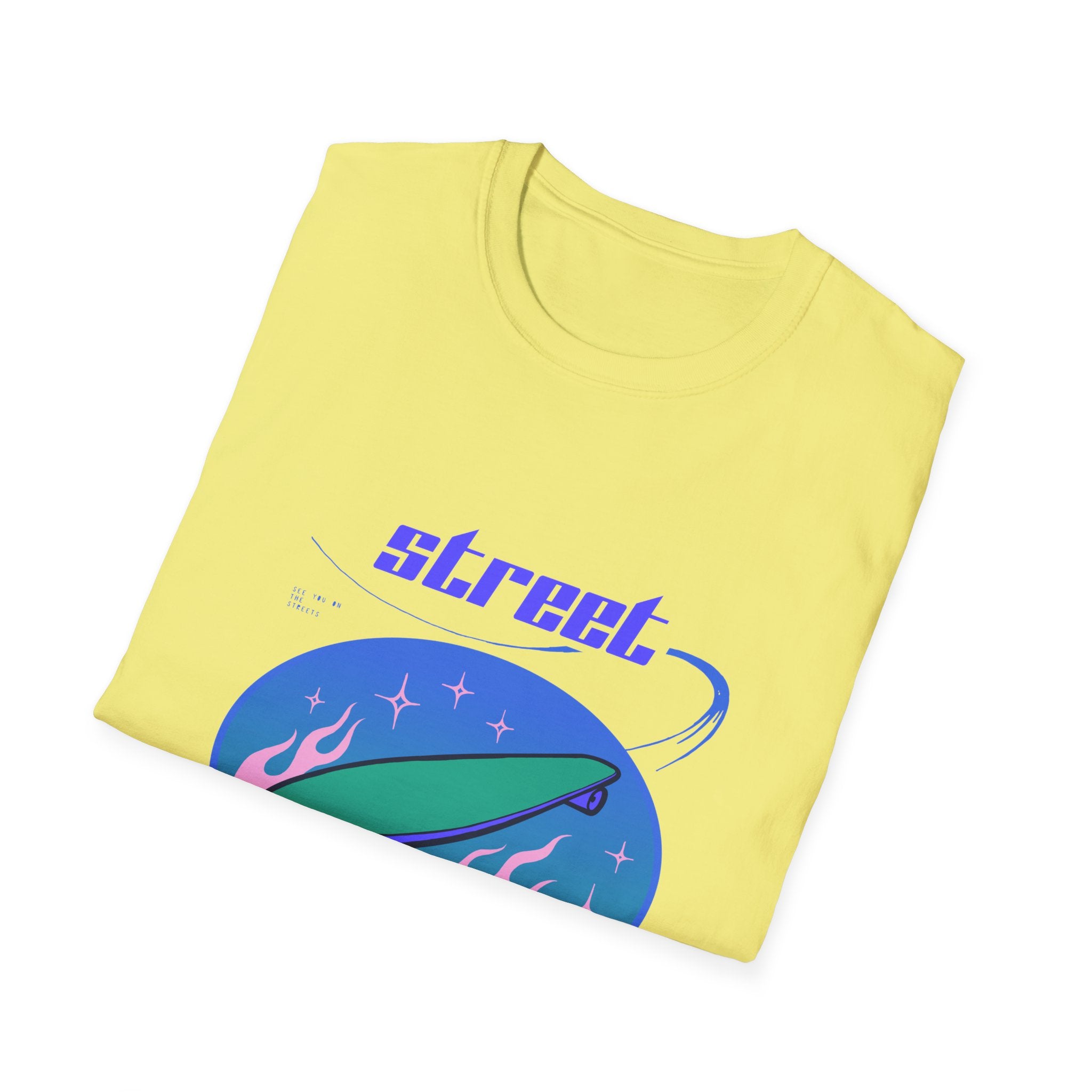 The folded Street Skater T-Shirt showcases the word 'street' and a skateboard graphic on a yellow fabric, contrasted brilliantly by a vibrant blue and pink background. Crafted from lightweight material, it's ideal for practicing your skate moves with flair.
