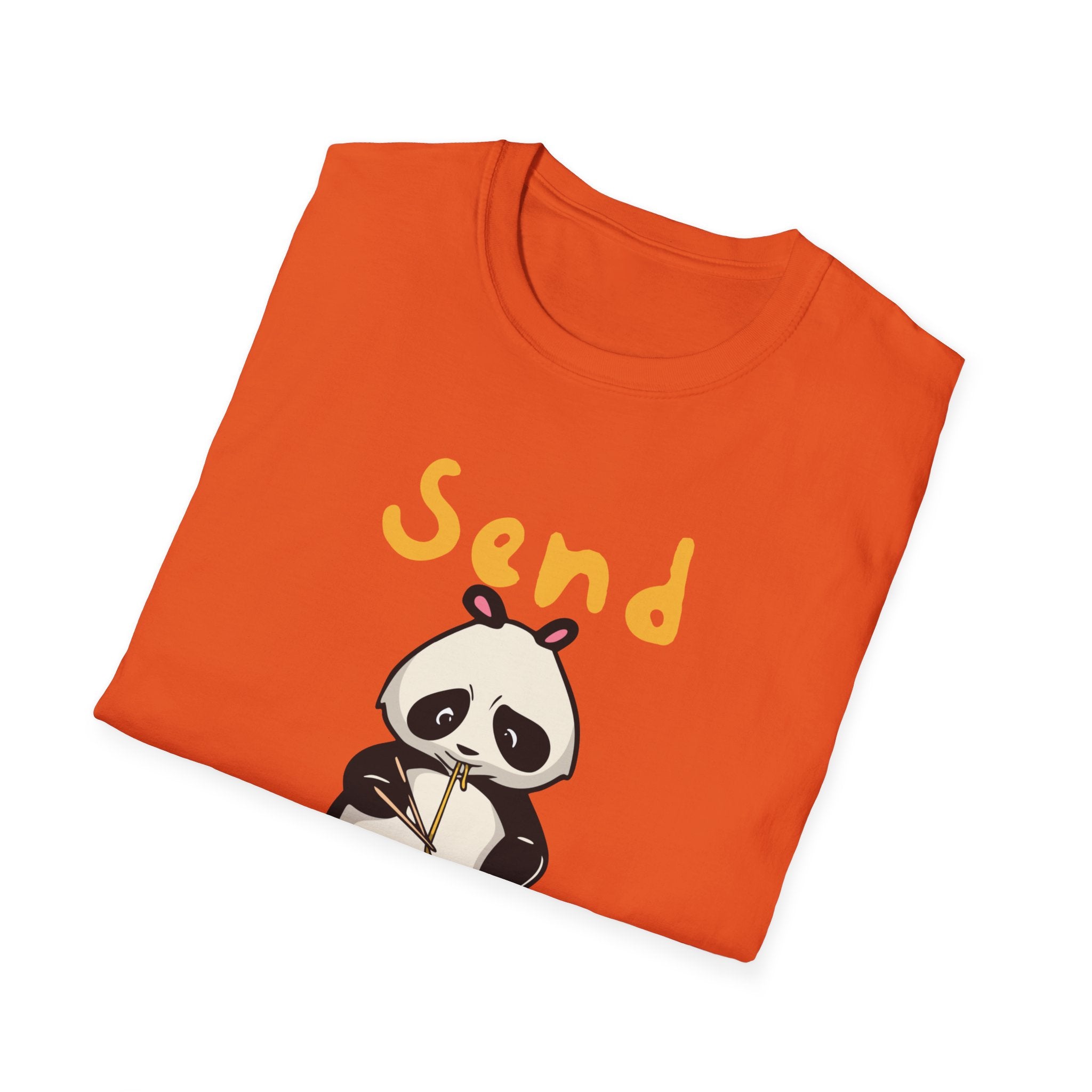 A neatly folded orange "Send Noods T-Shirt" featuring a cartoon panda and the humorous phrase "Send Noods" printed above it.