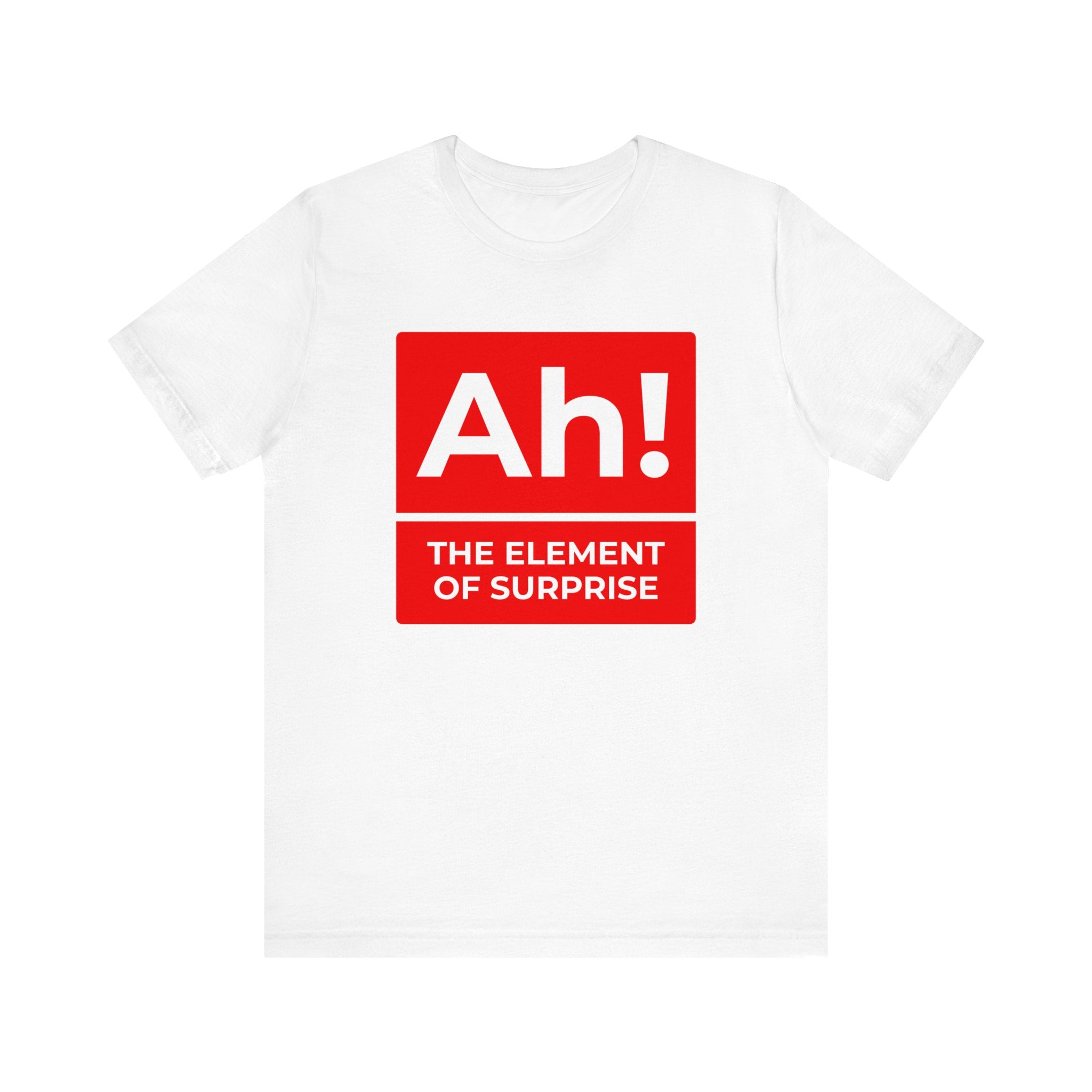 The "Ah! the Element of Surprise" T-shirt is a white, comfy tee featuring a periodic table-style red square with the text—ideal for science enthusiasts and nerds.