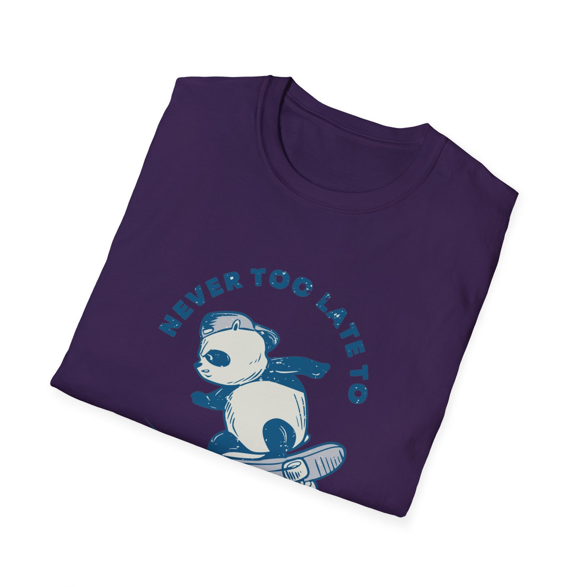 Folded Never Too Late to Skate T-Shirt in purple, featuring a cartoon panda on a skateboard and highlighting the love of skating.