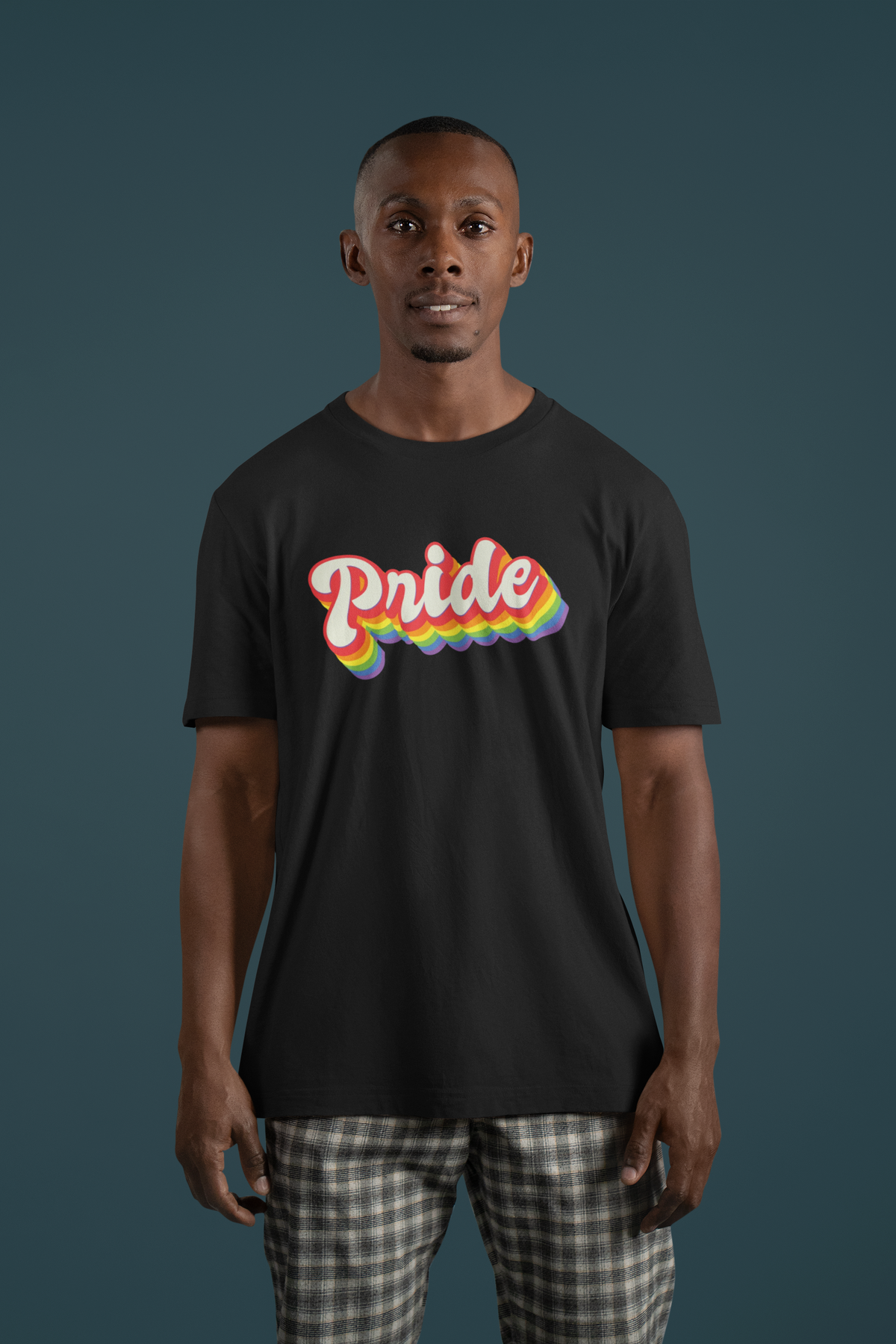Pride Rainbow T-shirt in black, man wearing it in a studio setting, gift for pride month