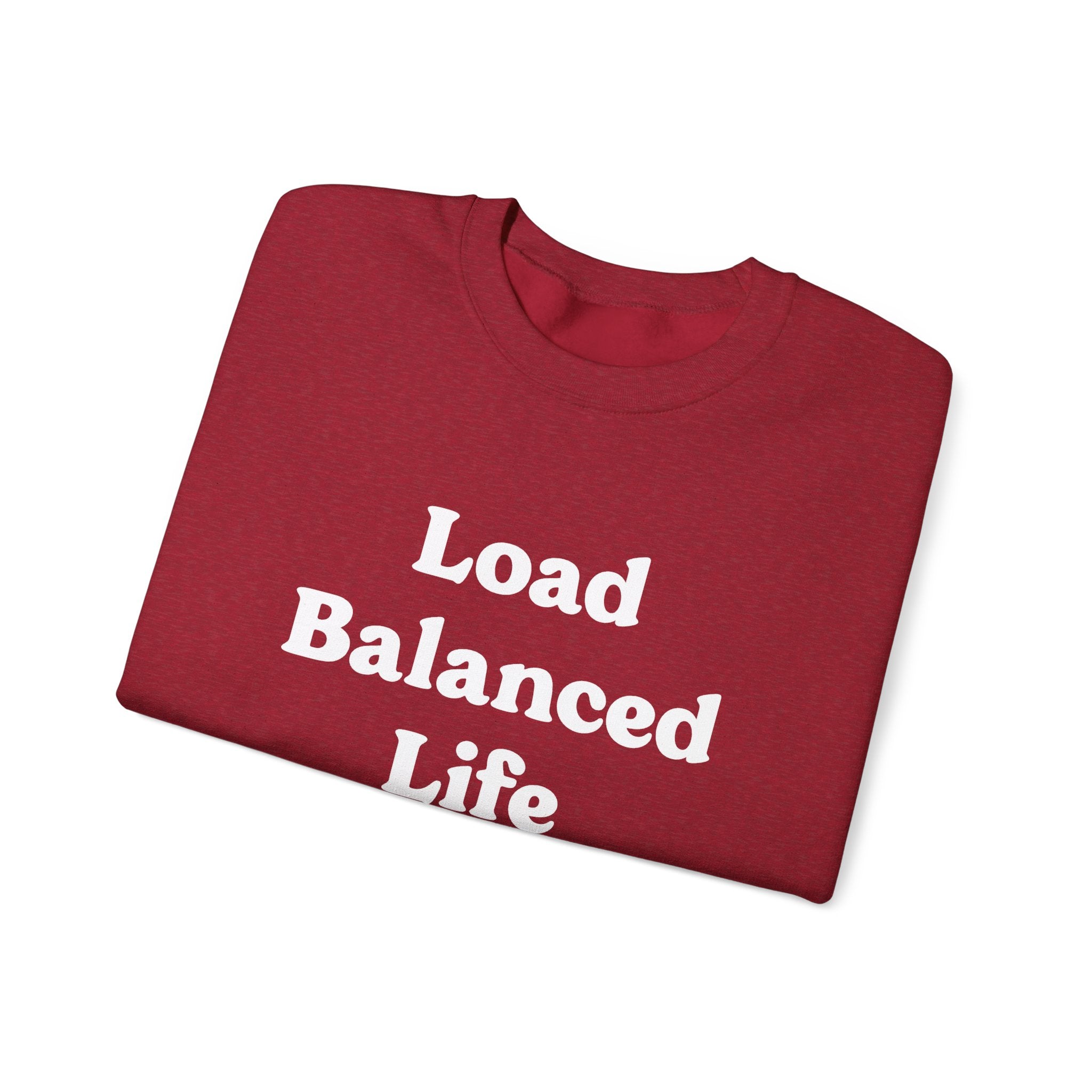 The "Load Balanced Life" sweatshirt features a folded red design with crisp white lettering, combining stylish appeal with cozy comfort.