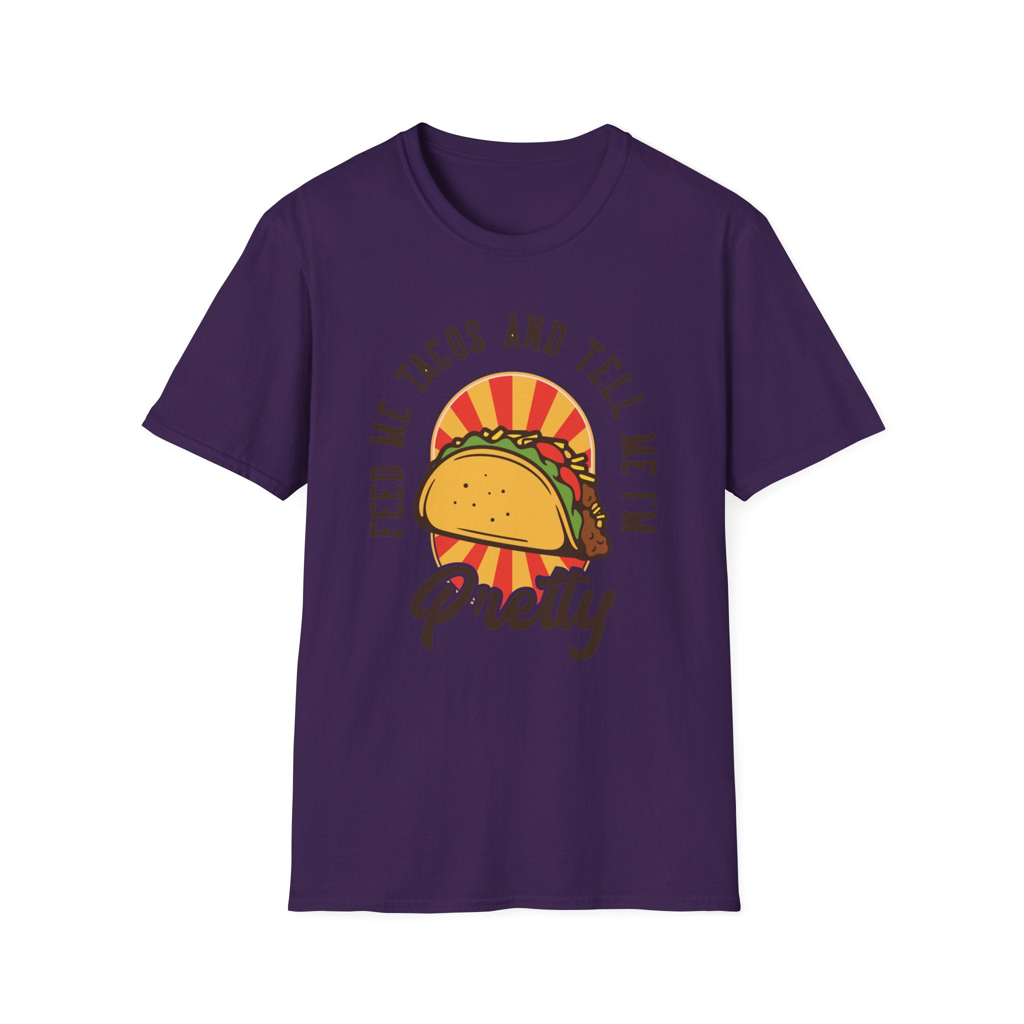 A Taco T-Shirt in dark purple, ideal for taco enthusiasts, showcases a graphic of a taco along with the bold yellow and red text "Feed Me Tacos and Tell Me I'm Pretty." Perfect attire for celebrating Taco Tuesdays with flair!