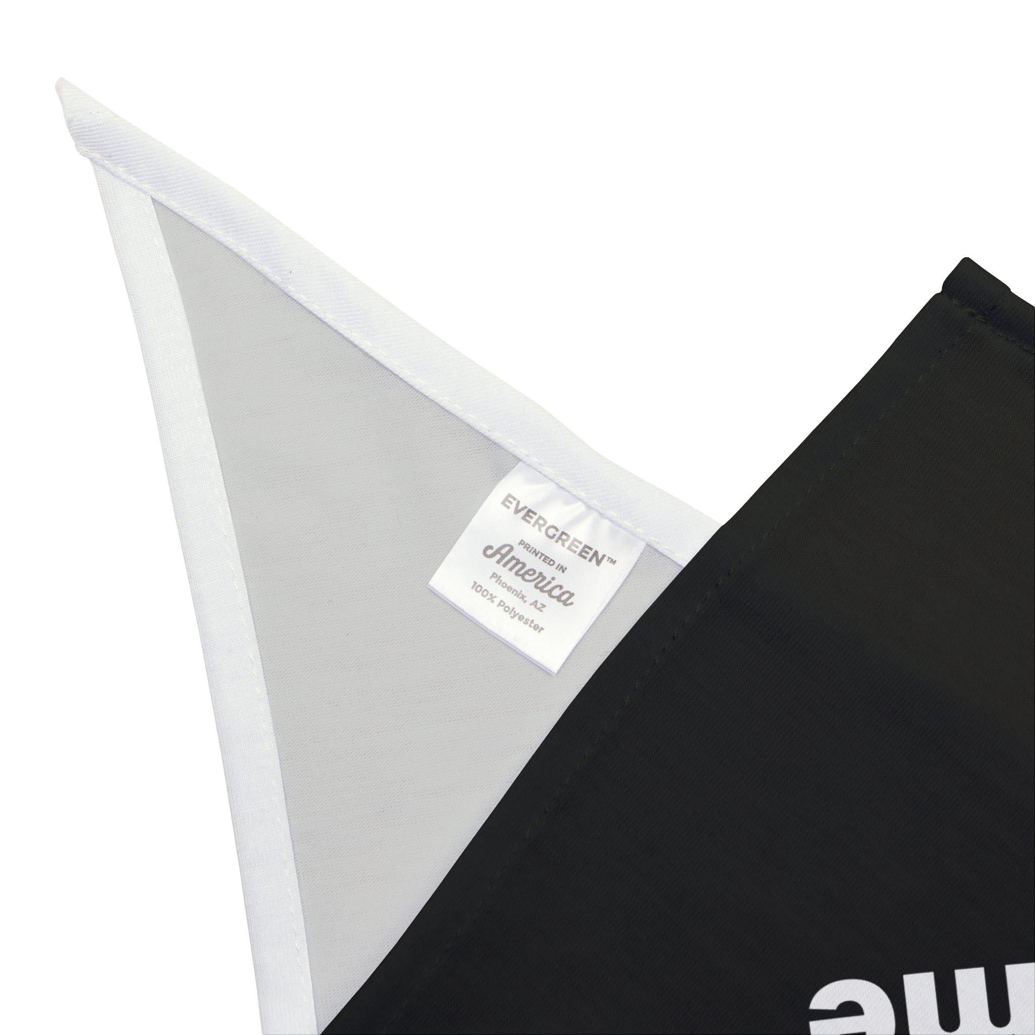 Close-up of a black and white fabric with a sewn-in label reading "EVERGREEN America 100% soft-spun polyester," reminiscent of the Redundancy Is My Middle Name - Pet Bandana style.