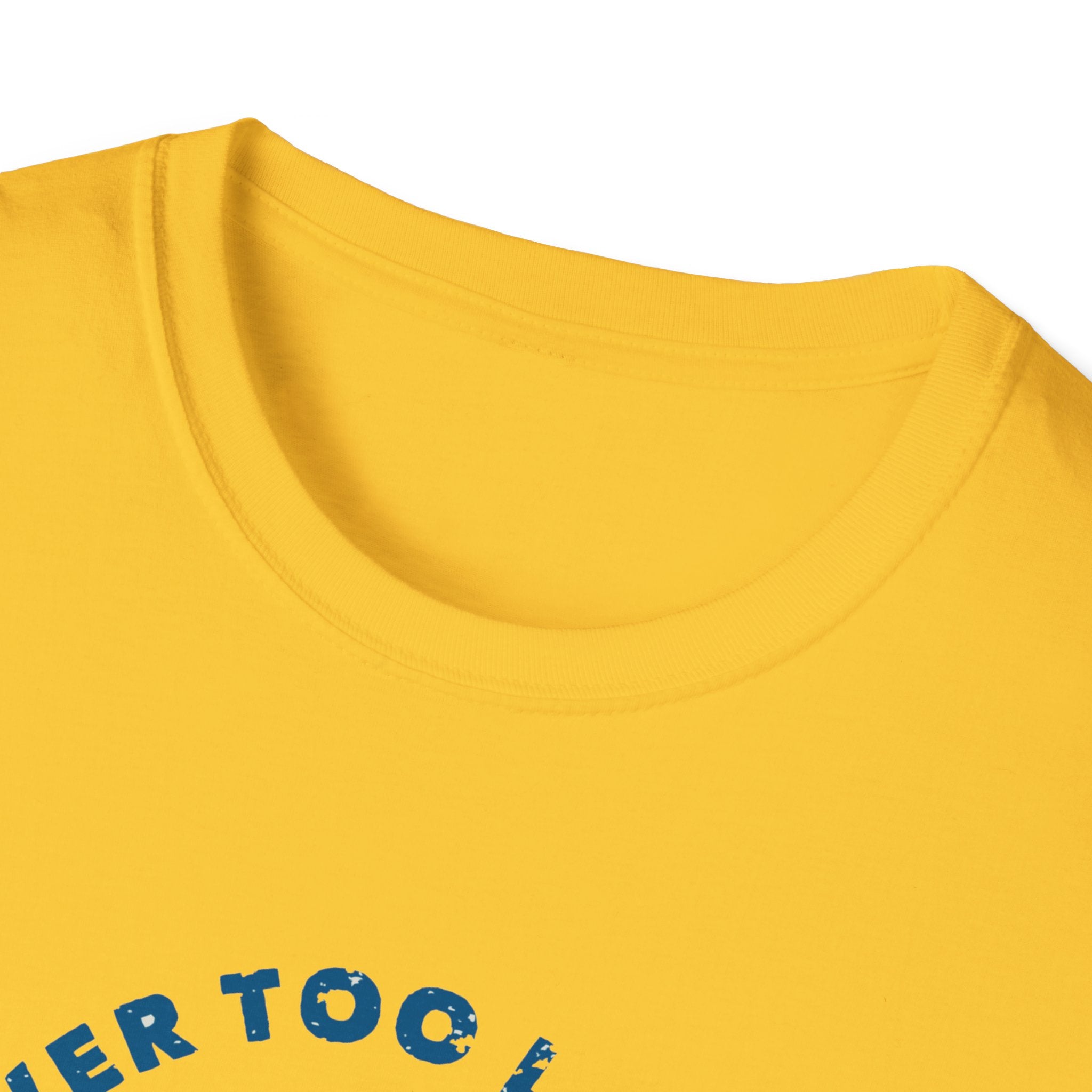 Close-up of a yellow "Never Too Late to Skate" T-shirt, showcasing partially visible blue text on the front, embodying the spirit of skating enthusiasts.