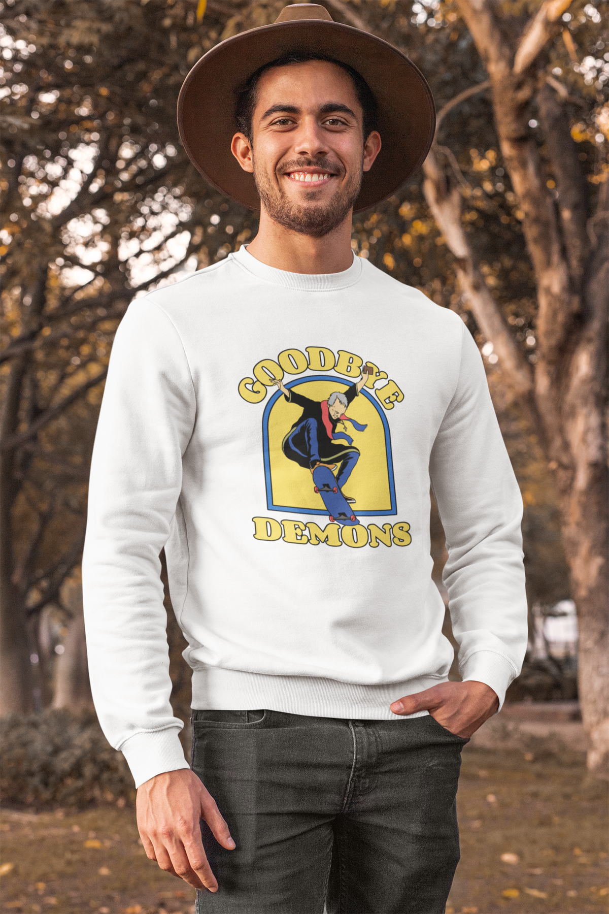 'Goodbye Demons' funny exorcist skater sweatshirt in white, man wearing it outdoors fall setting, gift
