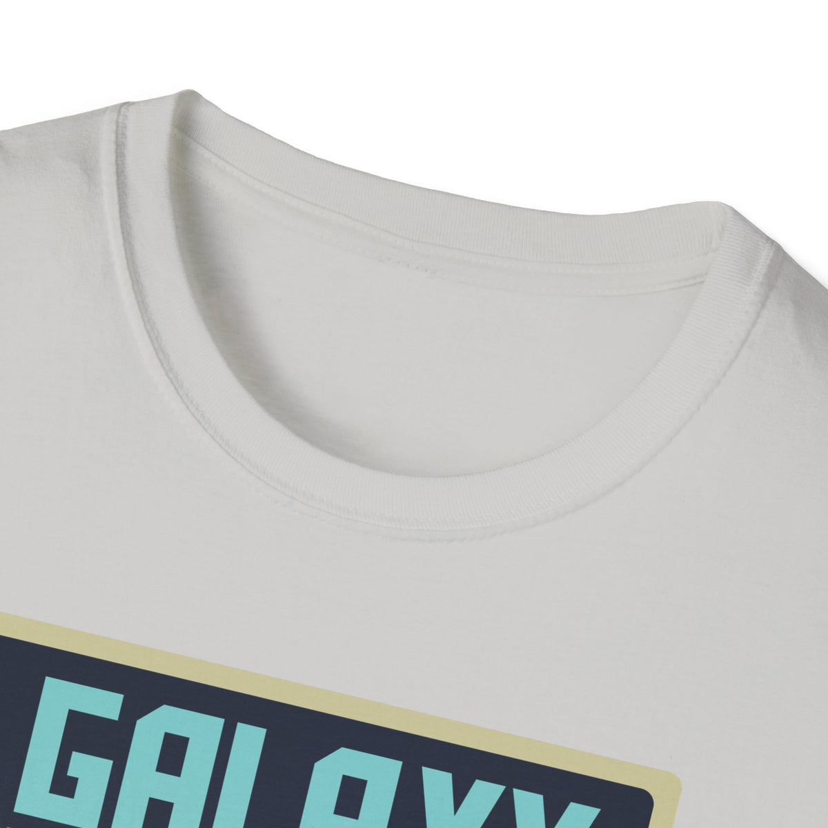 Close-up of "Galaxy Invaders" teal text print on light grey t-shirt collar, retro arcade detail