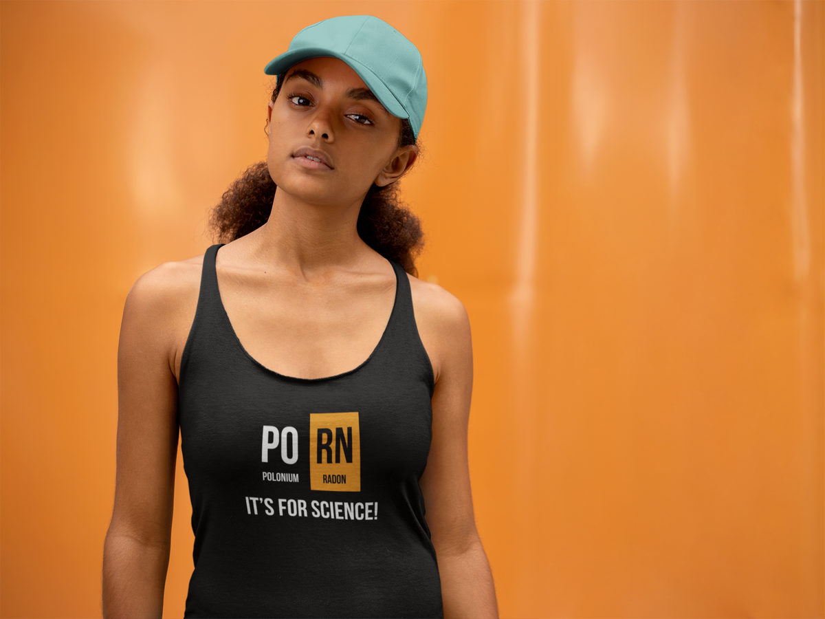 'PO-RN Periodic Table Women's Tank' in black, woman by an orange wall, Tank Top mockup, Geekpsters
