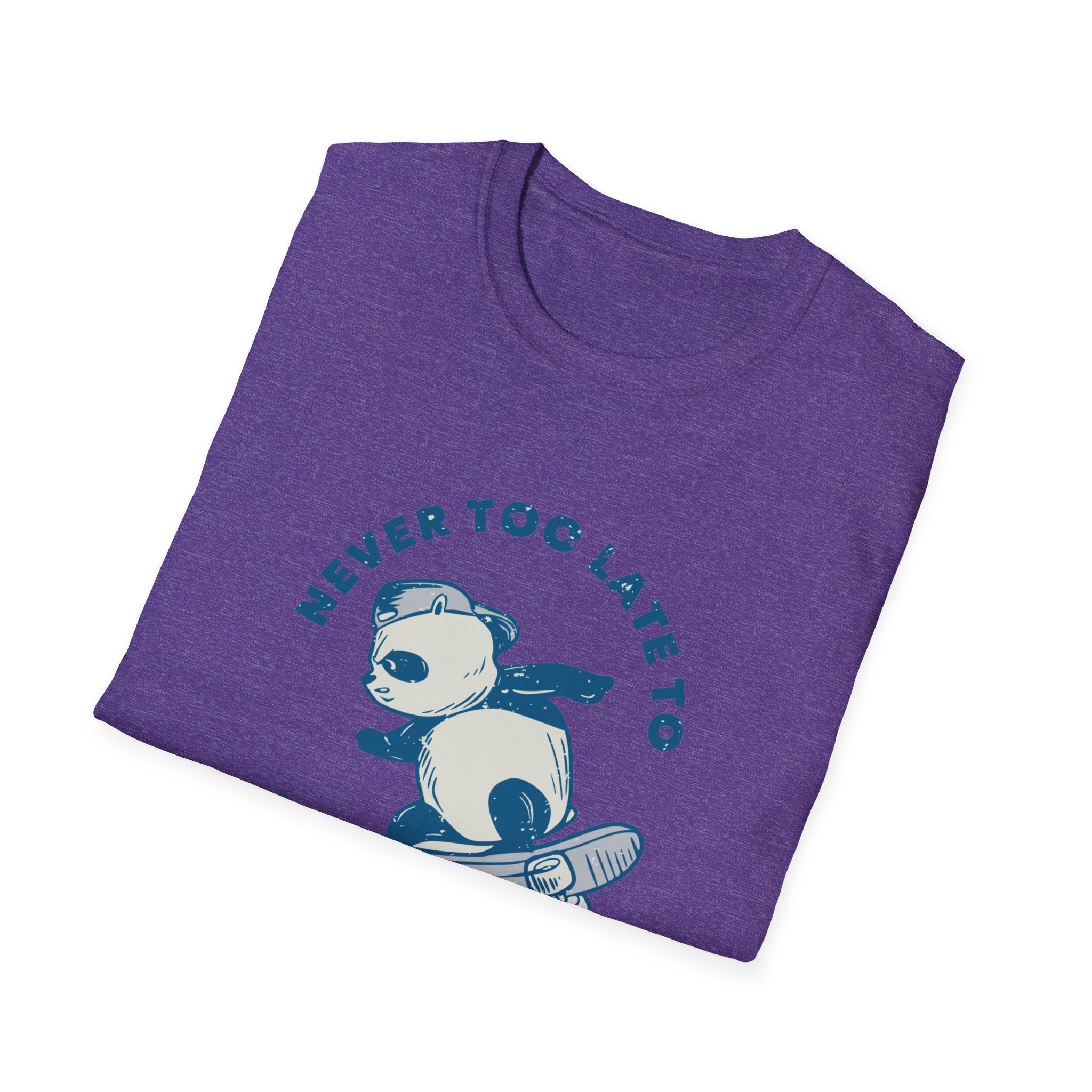 The "Never Too Late to Skate" T-shirt is a purple tee illustrating a panda in a cape confidently holding a skateboard, perfect for skate enthusiasts who embrace the love of skating.