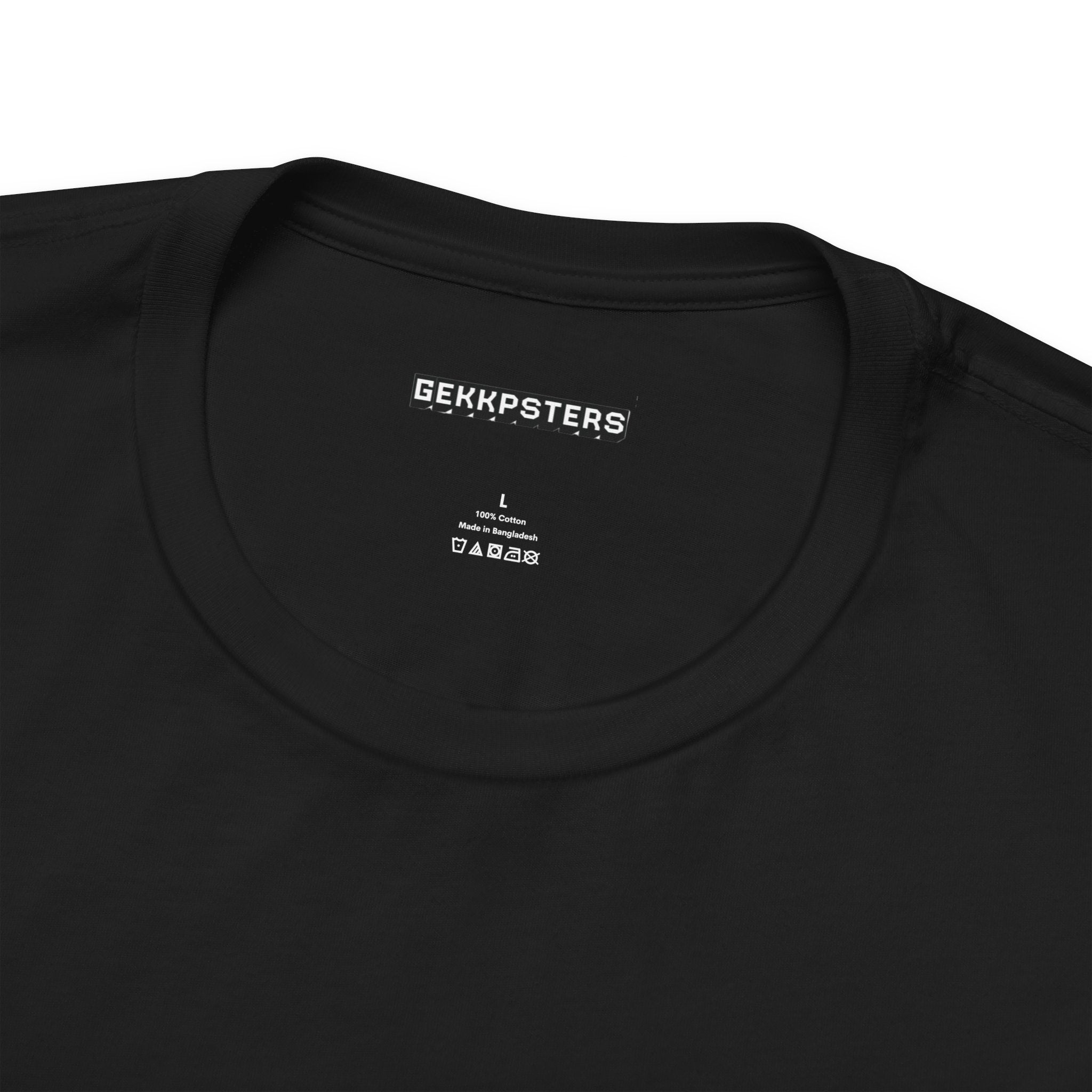 Close-up of the "Hello, I'm Anxious" T-shirt in black, featuring a playful design and a round neckline. Inside, the label displays "GEKKPSTERS" in white text, size L, alongside care instructions. It's ideal for those who resonate with an anxious vibe.