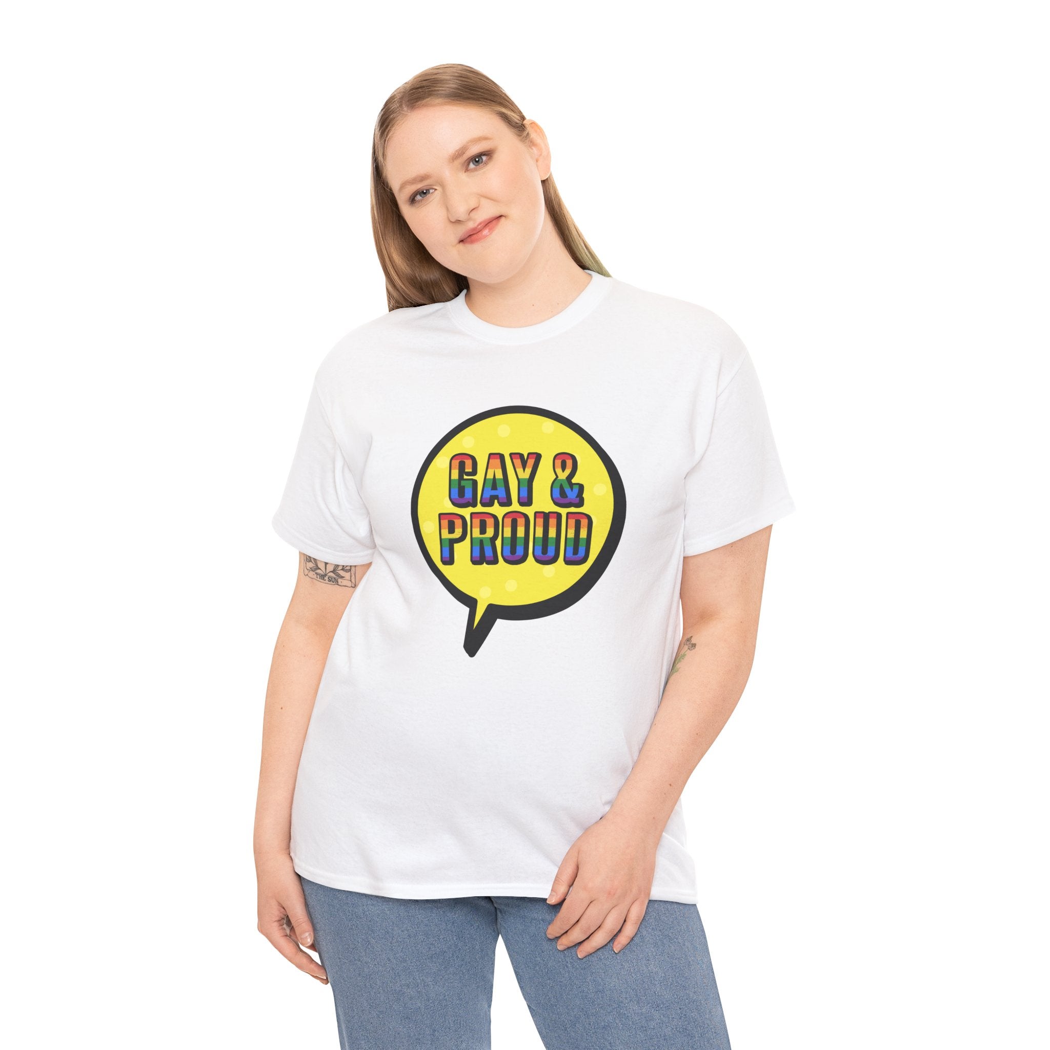 The individual sports a cozy Gay & Proud T-Shirt, made of soft white cotton and adorned with a colorful speech bubble design that boldly proclaims "Gay & Proud" in rainbow hues, making it ideal for daily attire.