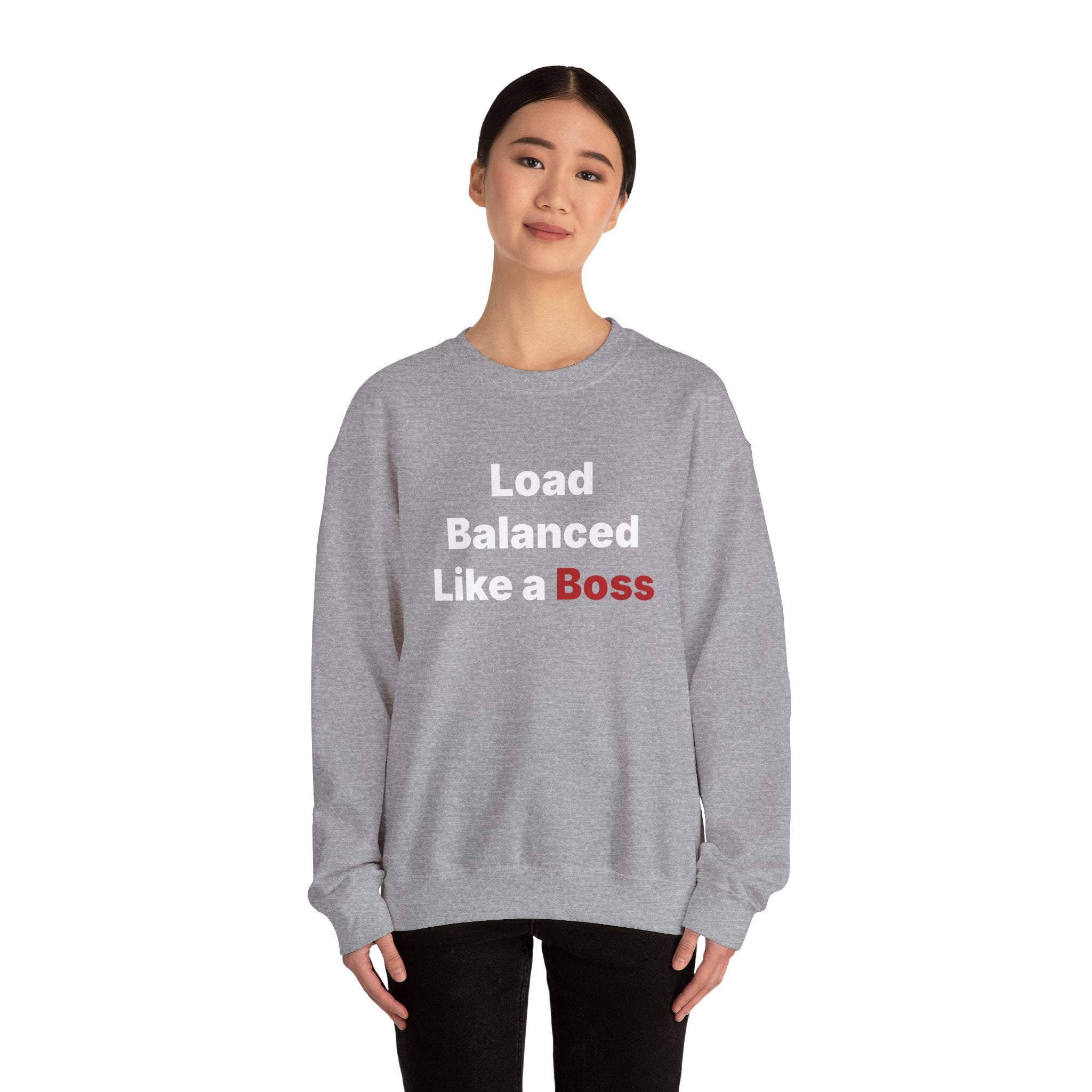 Dressed in the "Load Balanced Like a Boss" sweatshirt, a person is poised against a white background, well-prepared for the cooler temperatures.