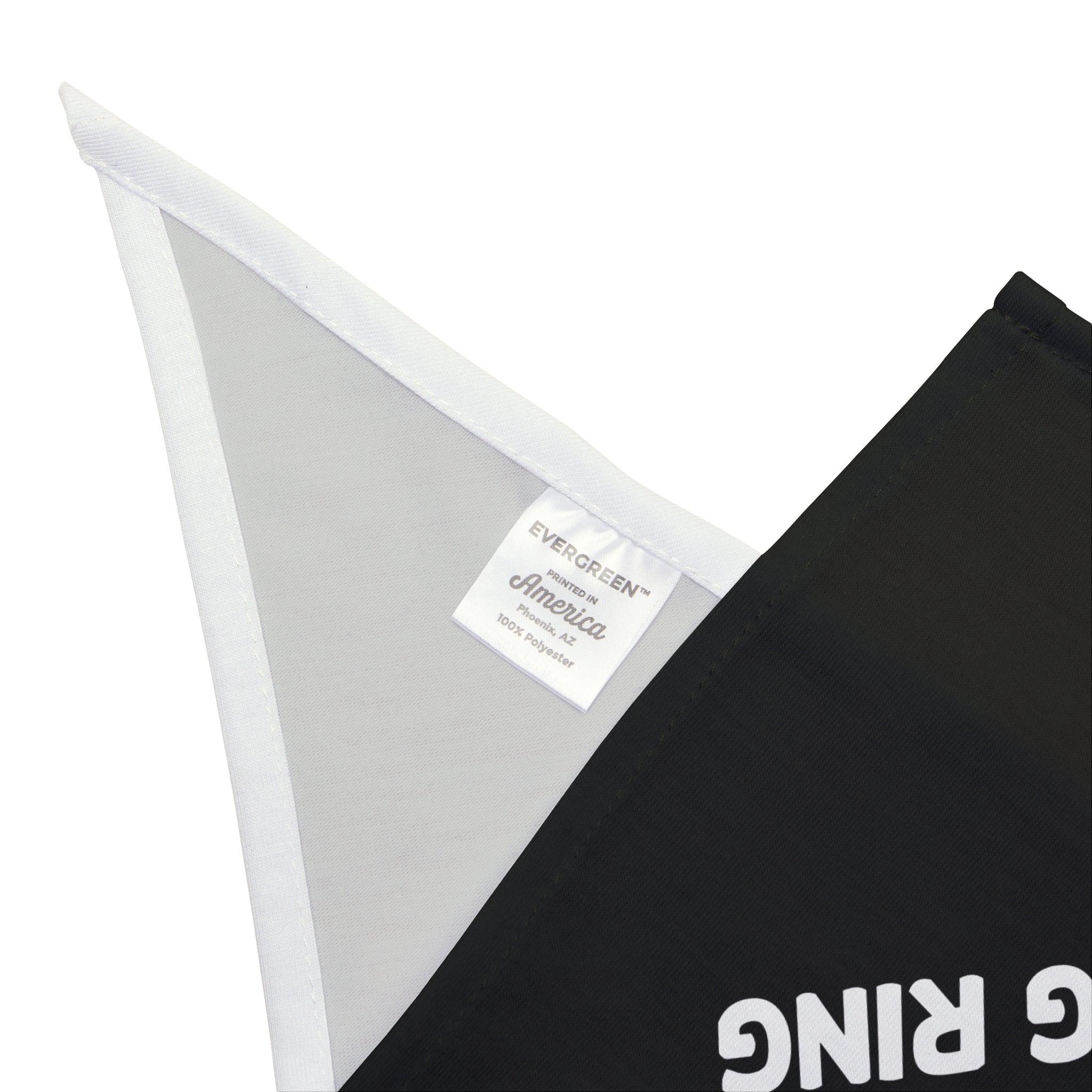 Close-up of a black fabric with a white triangular corner tag. The tag features the text: "EVERGREEN America 100% polyester." A section of a printed word on the black fabric is partially visible, offering both comfort and style, reminiscent of the premium feel of "This Discussion Deserved a Boxing Ring - Pet Bandana.