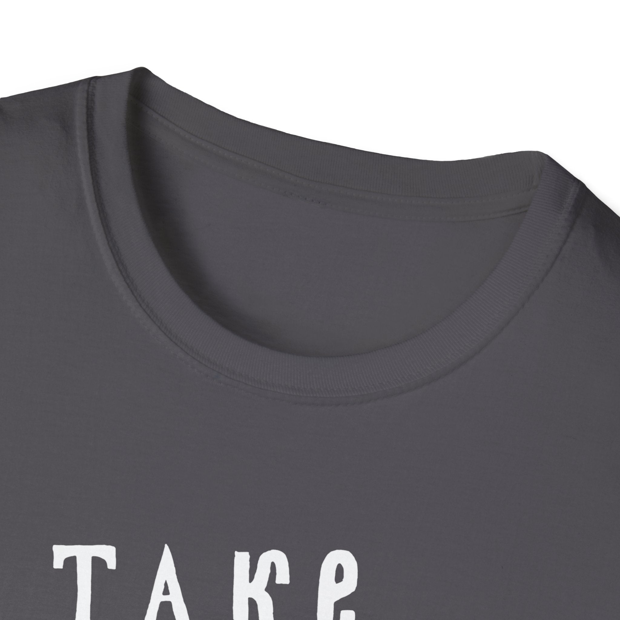 A close-up of a folded dark gray "Take Me to the Ocean" T-shirt, exuding geek style, with partially visible white text that reads "TAKE".