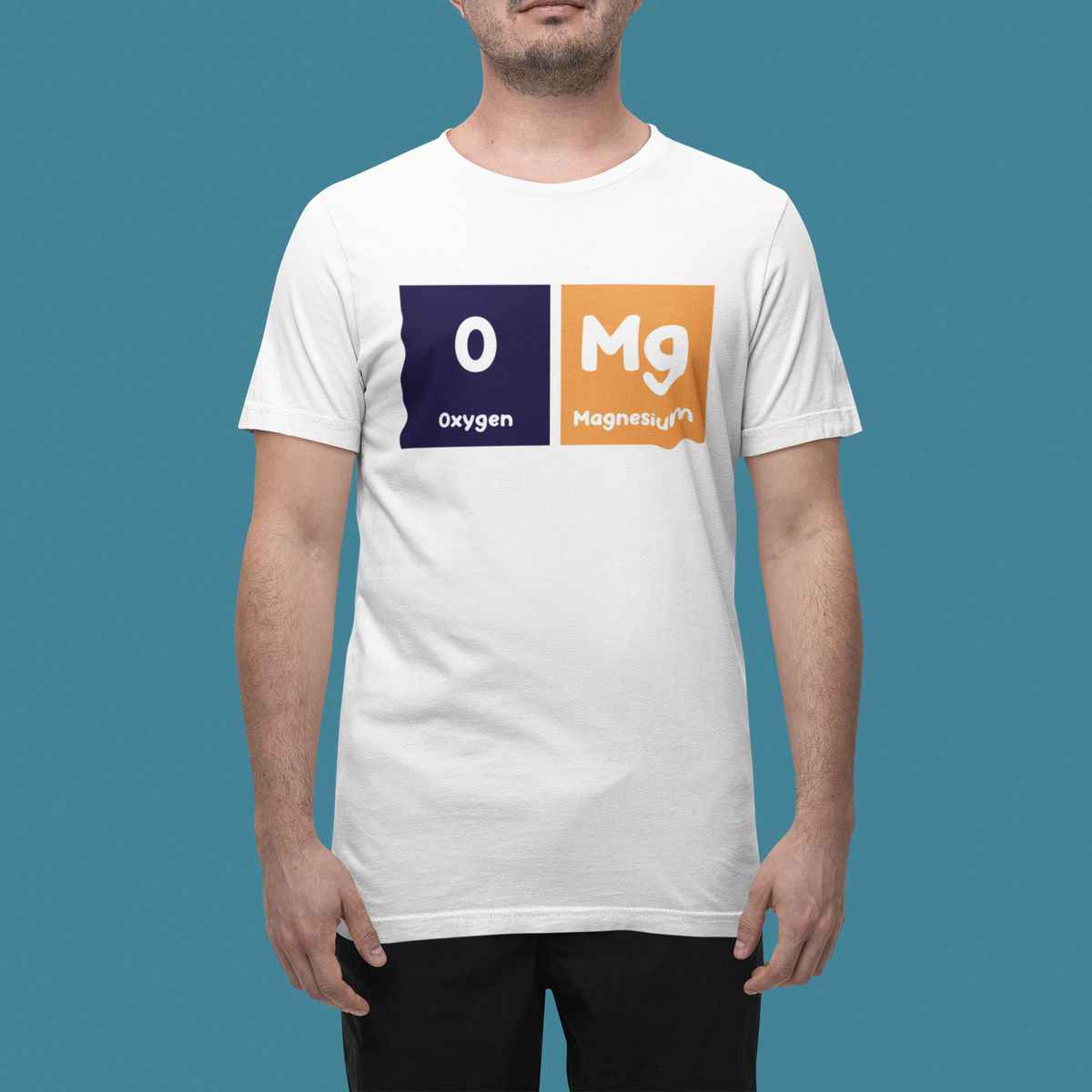 'O-Mg' periodic table t-shirt in white, man wearing it on a teal background, funny chemistry gift