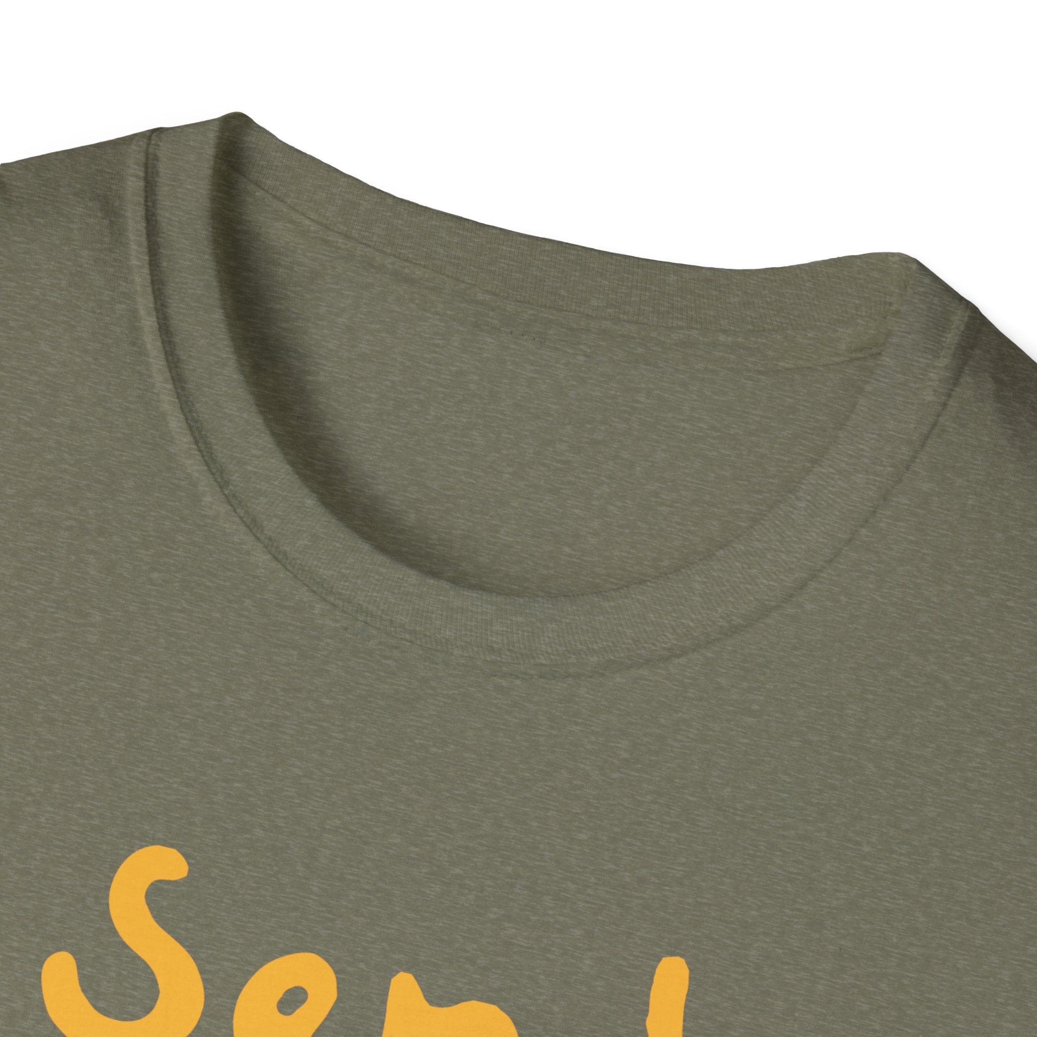 Close-up of a green Send Noods T-shirt collar with partially visible yellow text, providing a stylish fit that enhances the humorous design.