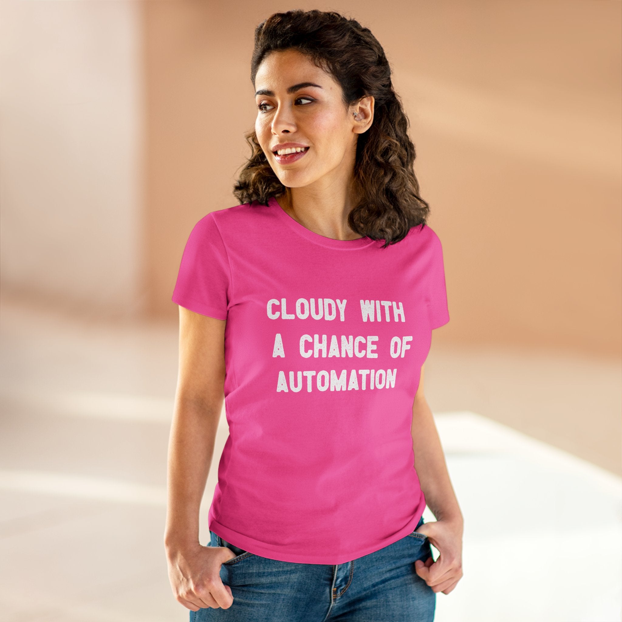 Indoors, a woman wears the Cloudy With a Chance of Automation - Women's Tee, made from soft cotton and featuring an eye-catching design, making it an ideal addition to any women's wardrobe.