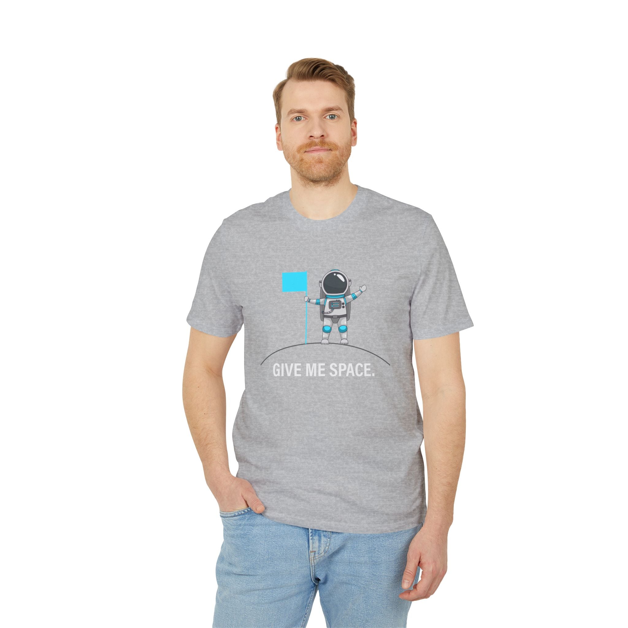A man wears the "Give me space - Organic T-Shirt," featuring a cartoon astronaut with a flag and the phrase "GIVE ME SPACE," against a plain white background—a fun, nerdy choice for space fans.