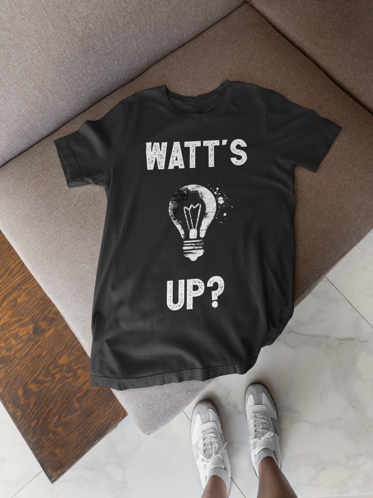 'Watt's Up?' electrician t-shirt in black, flat lay lifestyle with sneakers, funny pun tee gift