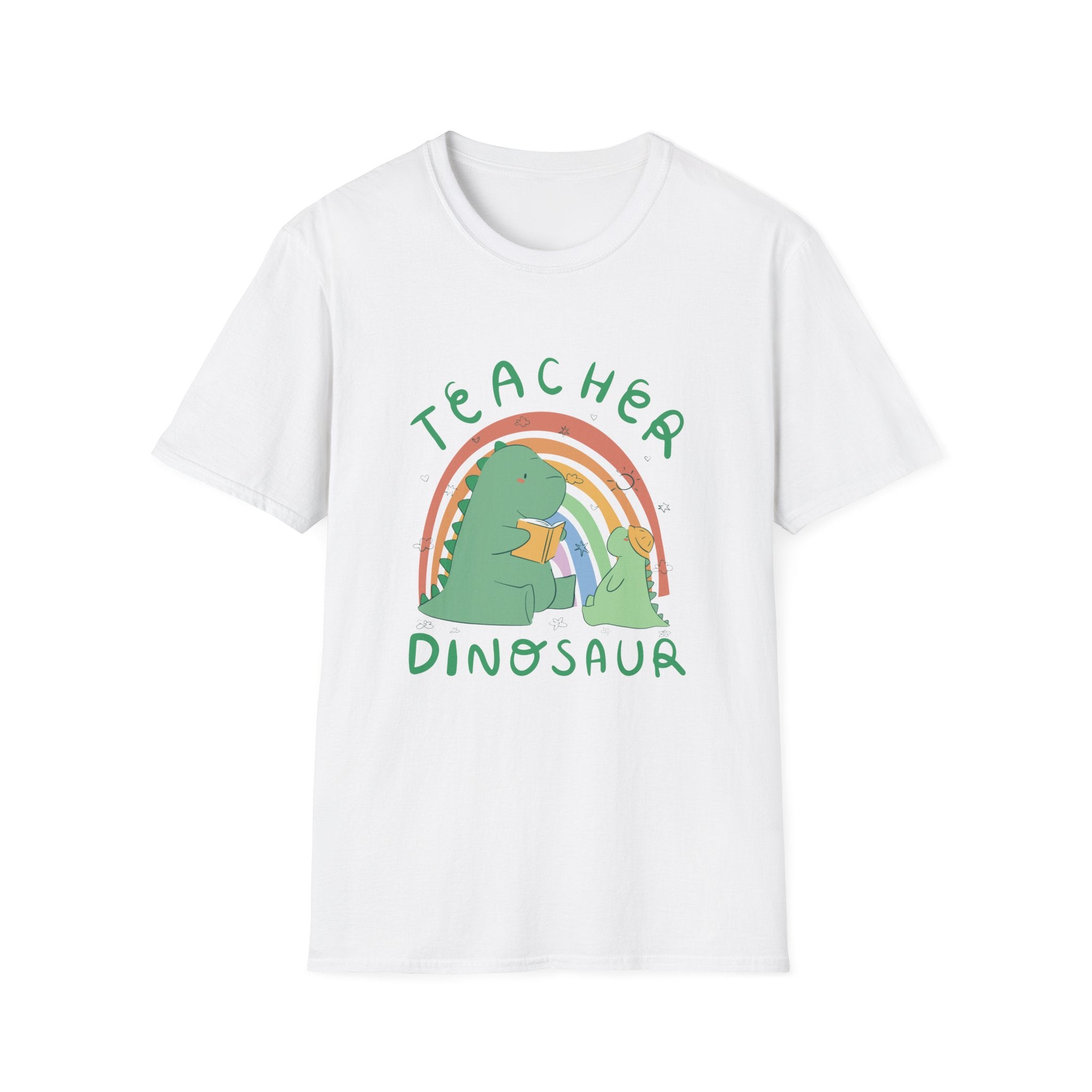 White Teacher Dinosaur T-Shirt featuring a cartoon dinosaur holding a book, encircled by a rainbow, with the text "Teacher Dinosaur." It's ideal for inspiring classrooms and promoting an enjoyable learning environment.