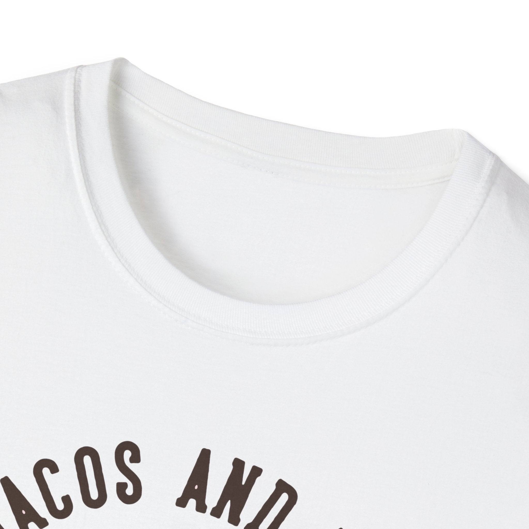 Close-up of a White T-Shirt featuring partial text "FEED ME TACOS AND" in black, arranged in a curved layout—ideal for taco enthusiasts looking to celebrate Taco Tuesdays.
