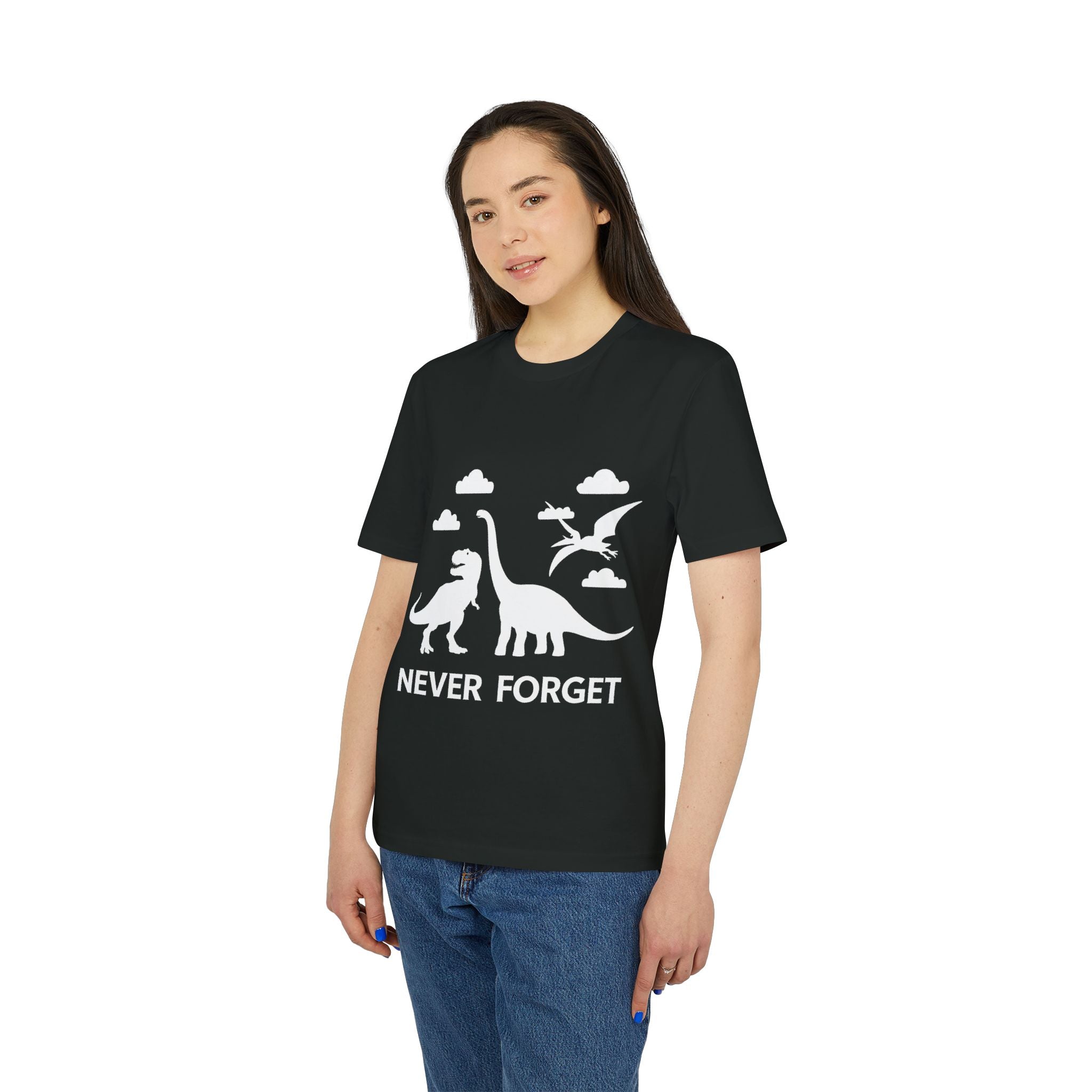Wearing the "Never Forget - Organic T-Shirt," an eco-friendly tee made from organic cotton, with white dinosaur and pterodactyl silhouettes, clouds, and the text "NEVER FORGET.
