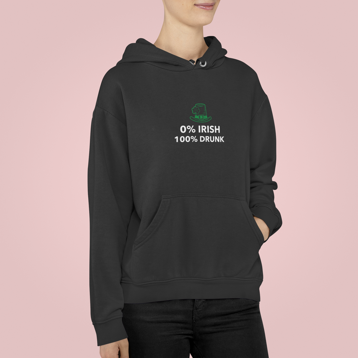 '0% Irish 100% Drunk' hoodie in black, woman wearing it on pink backdrop, funny St Patrick's Day gift