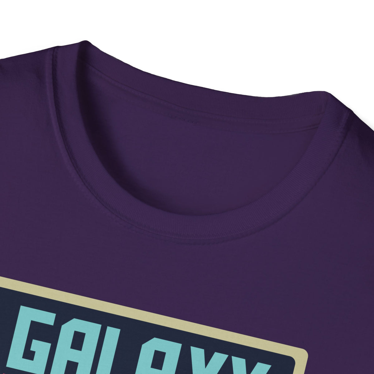 Close-up of "Galaxy Invaders" pixel UFO print on purple t-shirt collar, retro arcade graphic detail