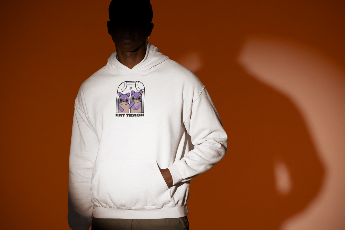 'Eat Trash Hoodie' in white, man under a spotlight, Hoodie mockup, Geekpsters
