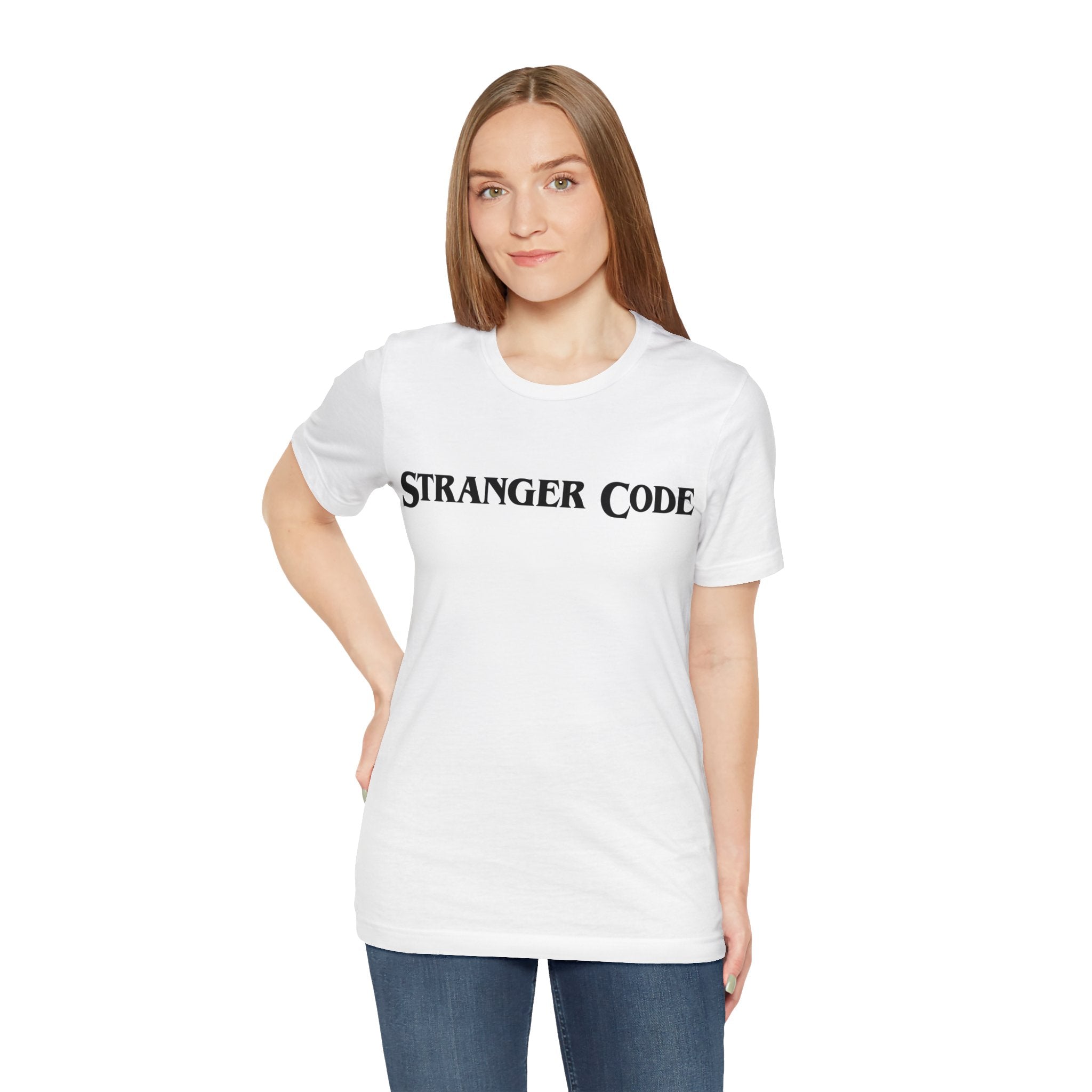 A person wearing the Stranger Code Tee Shirt stands against a plain background. The soft cotton fabric ensures comfort while the quality print adds a touch of style.