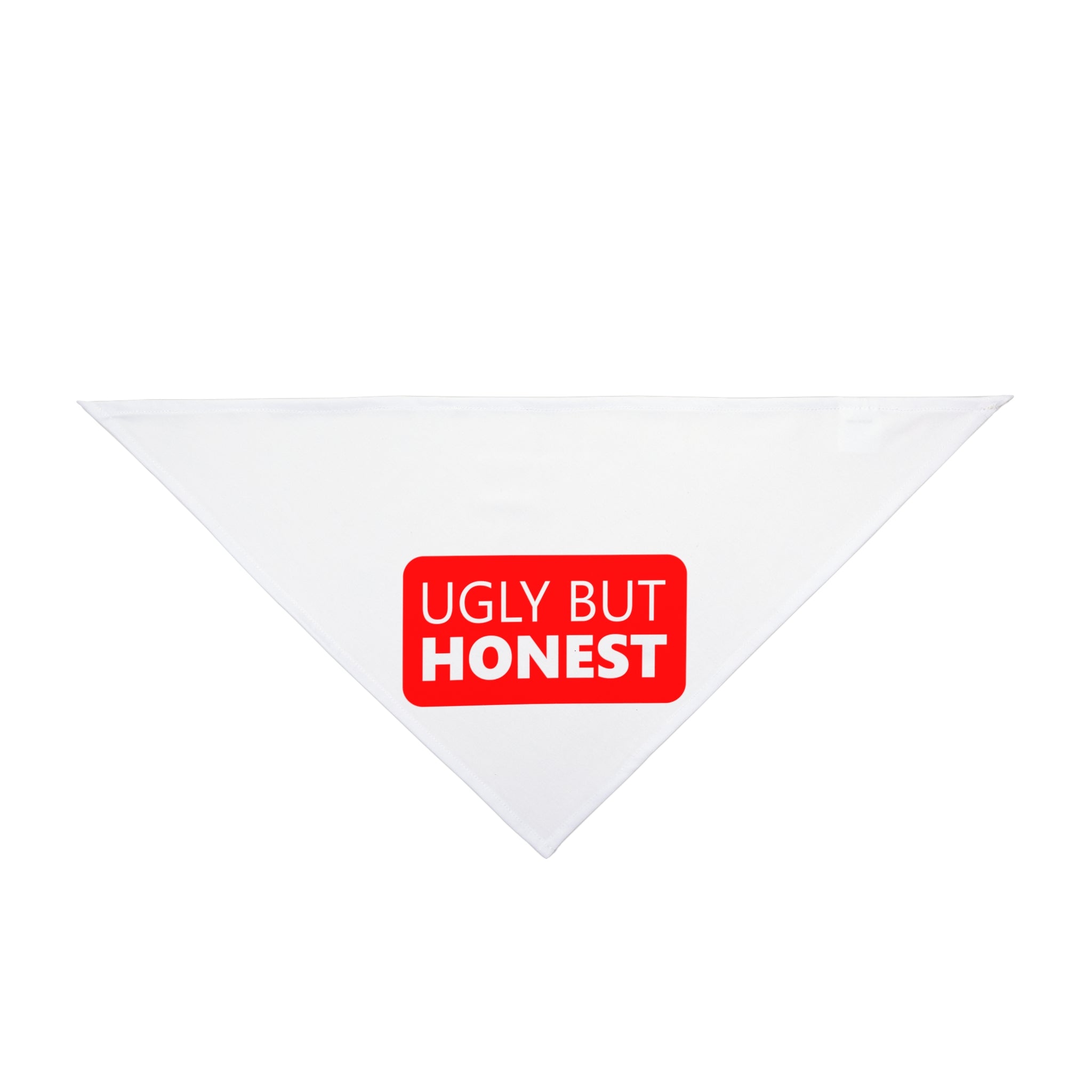 The Ugly but Honest Pet Bandana is a white triangular cloth with red and white text reading "UGLY BUT HONEST" at the center, ideal for pet owners who embrace nerd culture unapologetically.