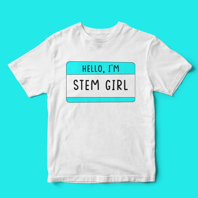The "Hello, I'm STEM Girl" T-shirt celebrates science and nerd culture with a turquoise name tag design on a white tee.