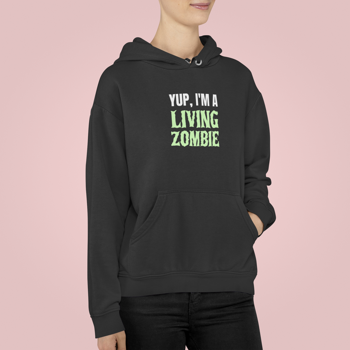 'Yup, I'm a Living Zombie' hoodie in black, woman wearing it in studio, funny zombie hoodie gift