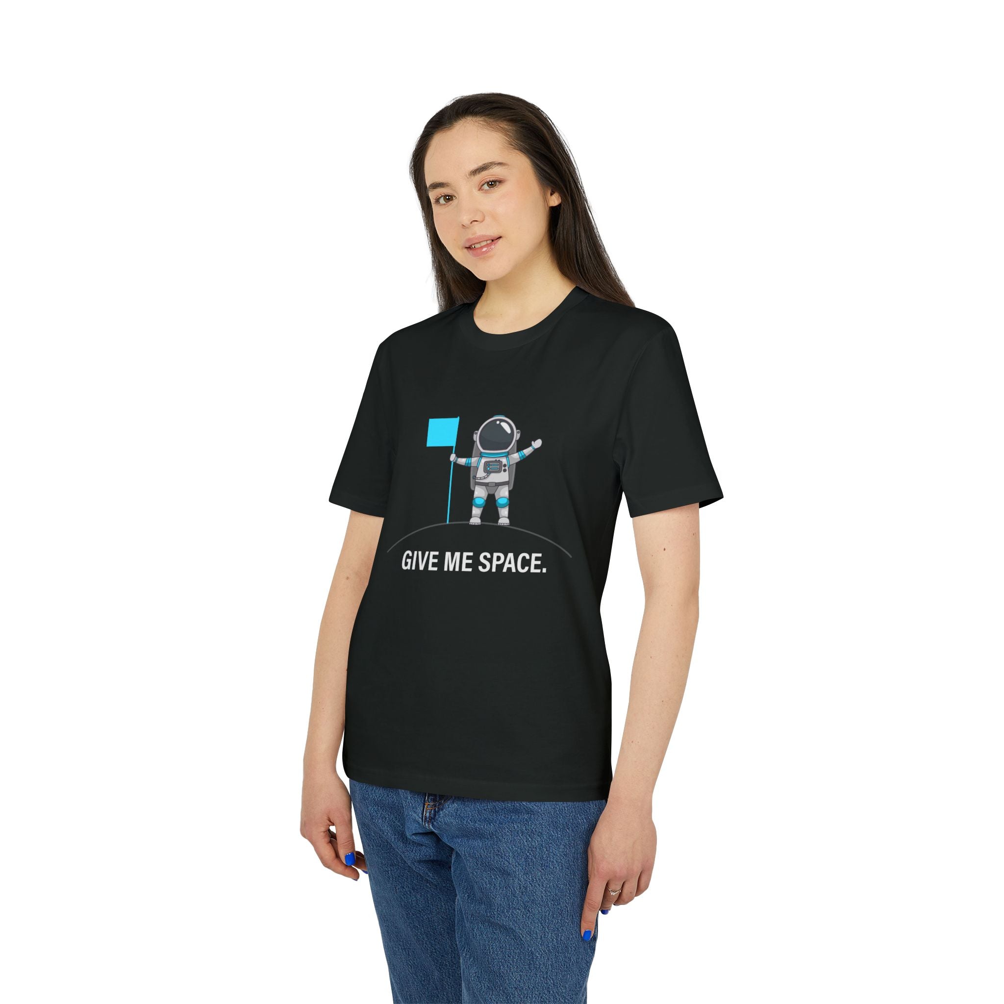 A woman wears the “Give me space - Organic T-Shirt”: a black tee featuring an astronaut with a flag and “GIVE ME SPACE.” text. This comfortable, stylish organic cotton shirt is perfect for space lovers.