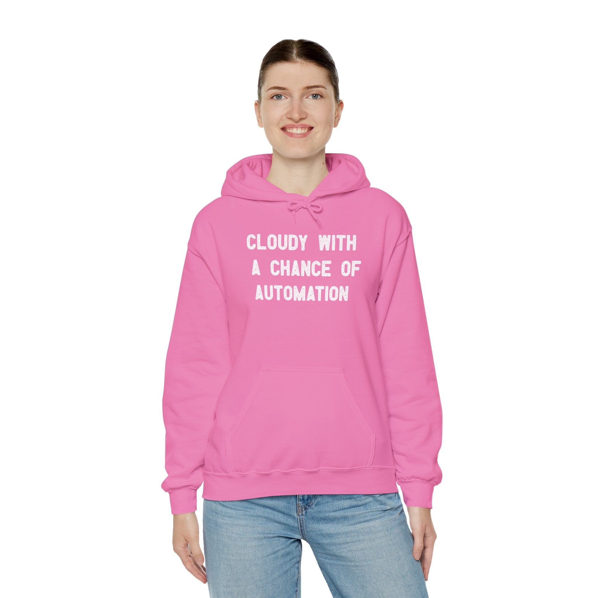A person wearing the "Cloudy With a Chance of Automation" hooded sweatshirt in pink, crafted from a heavy blend material, stands against a plain white background.