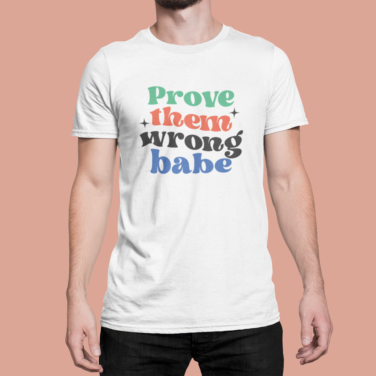 'Prove Them Wrong Babe' t-shirt in white, man wearing it on pink background