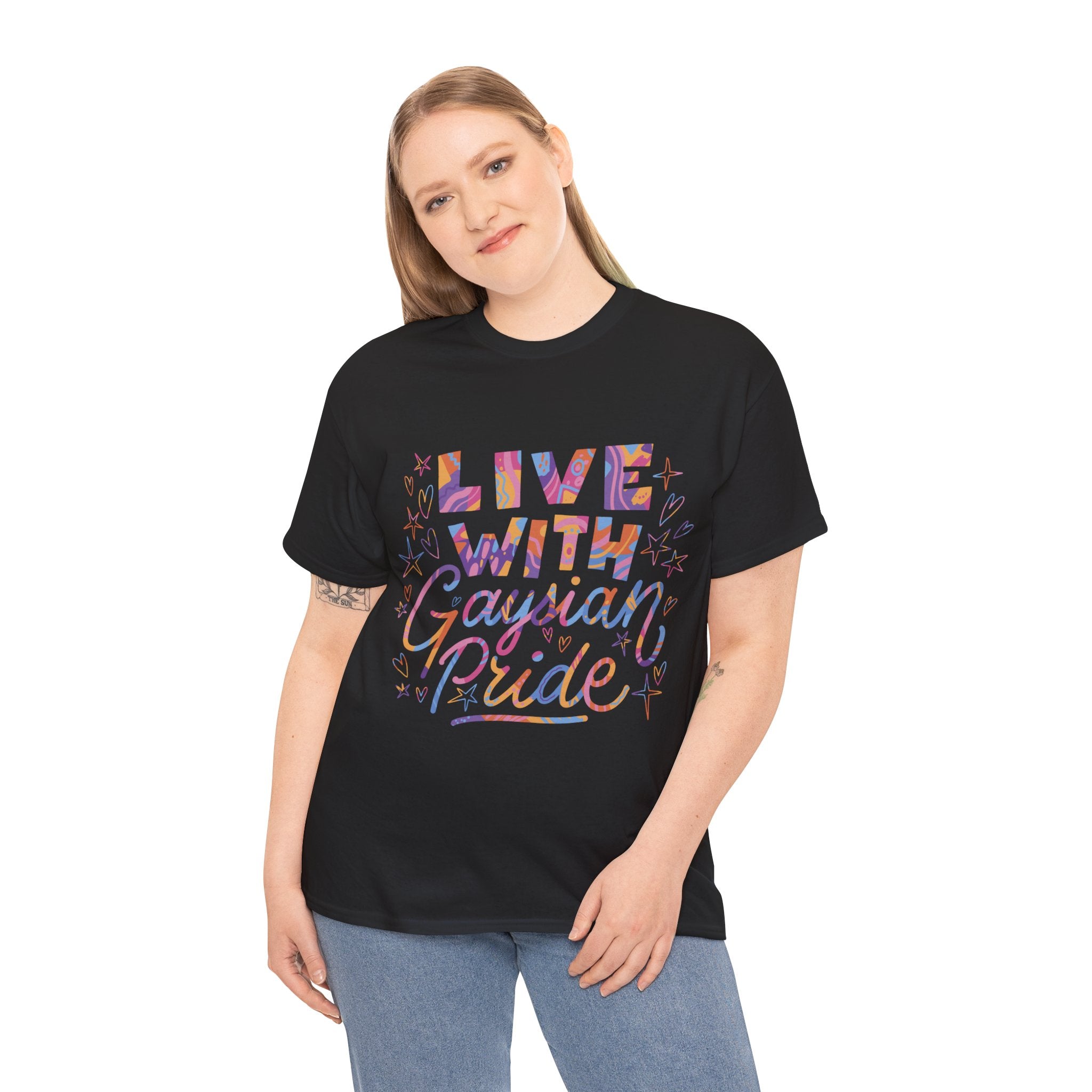 A person in a black "Live With Gaydian Pride" T-shirt showcasing colorful text stands confidently against a white background.